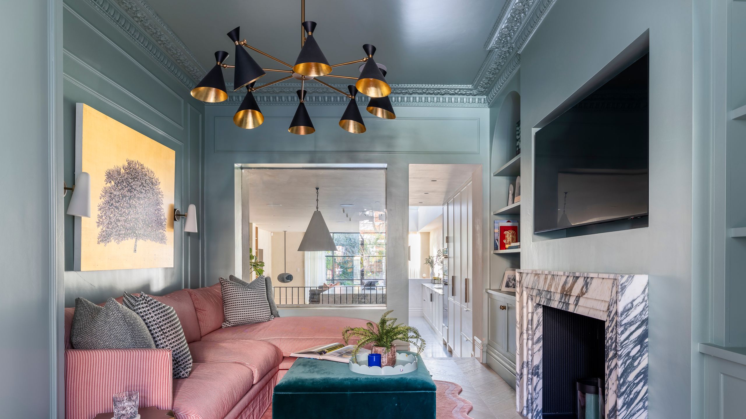 Image may contain: Home Decor, Plant, Indoors, Interior Design, Lamp, Computer Hardware, Electronics, Hardware, and Monitor