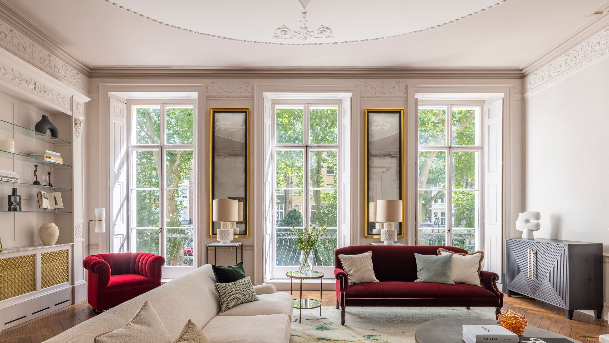 Image may contain: French Window, Window, Couch, Furniture, Lamp, Home Decor, Plant, Architecture, Building, and Indoors