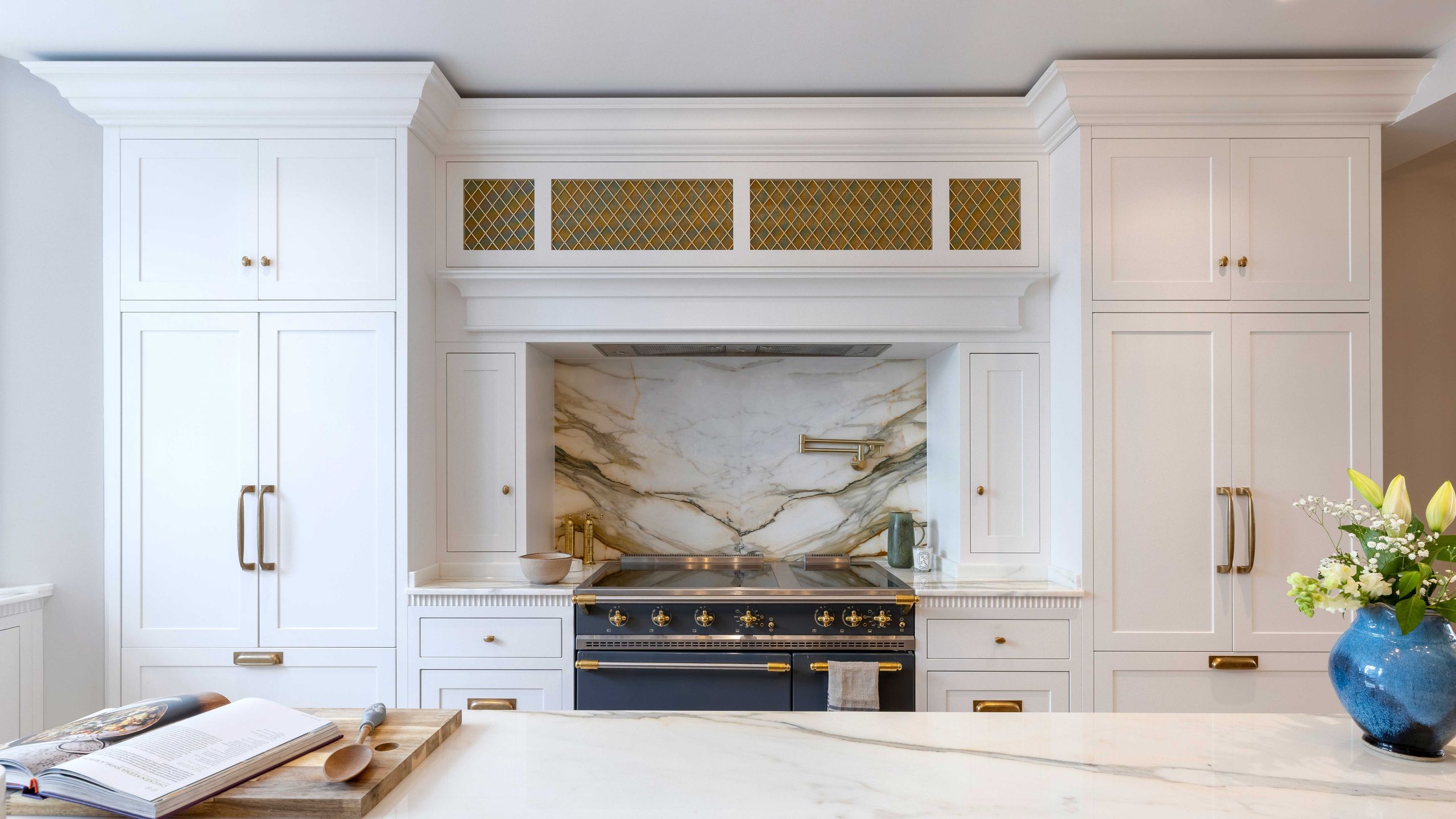 Image may contain: Indoors, Interior Design, Floor, Fireplace, Cooktop, and Kitchen