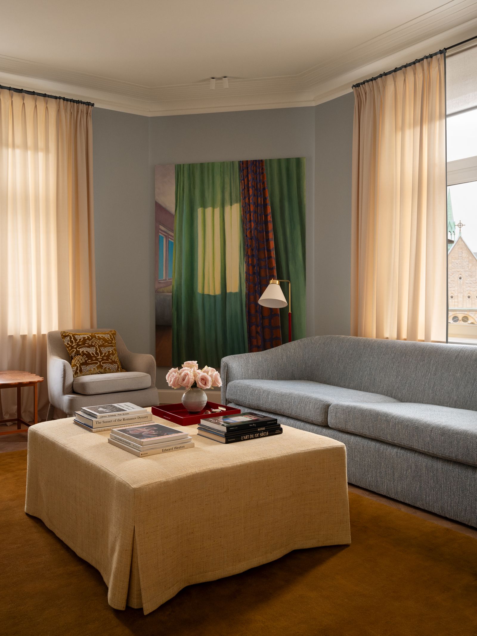 Image may contain Furniture Couch Lamp Architecture Building Indoors Living Room Room Home Decor and Book