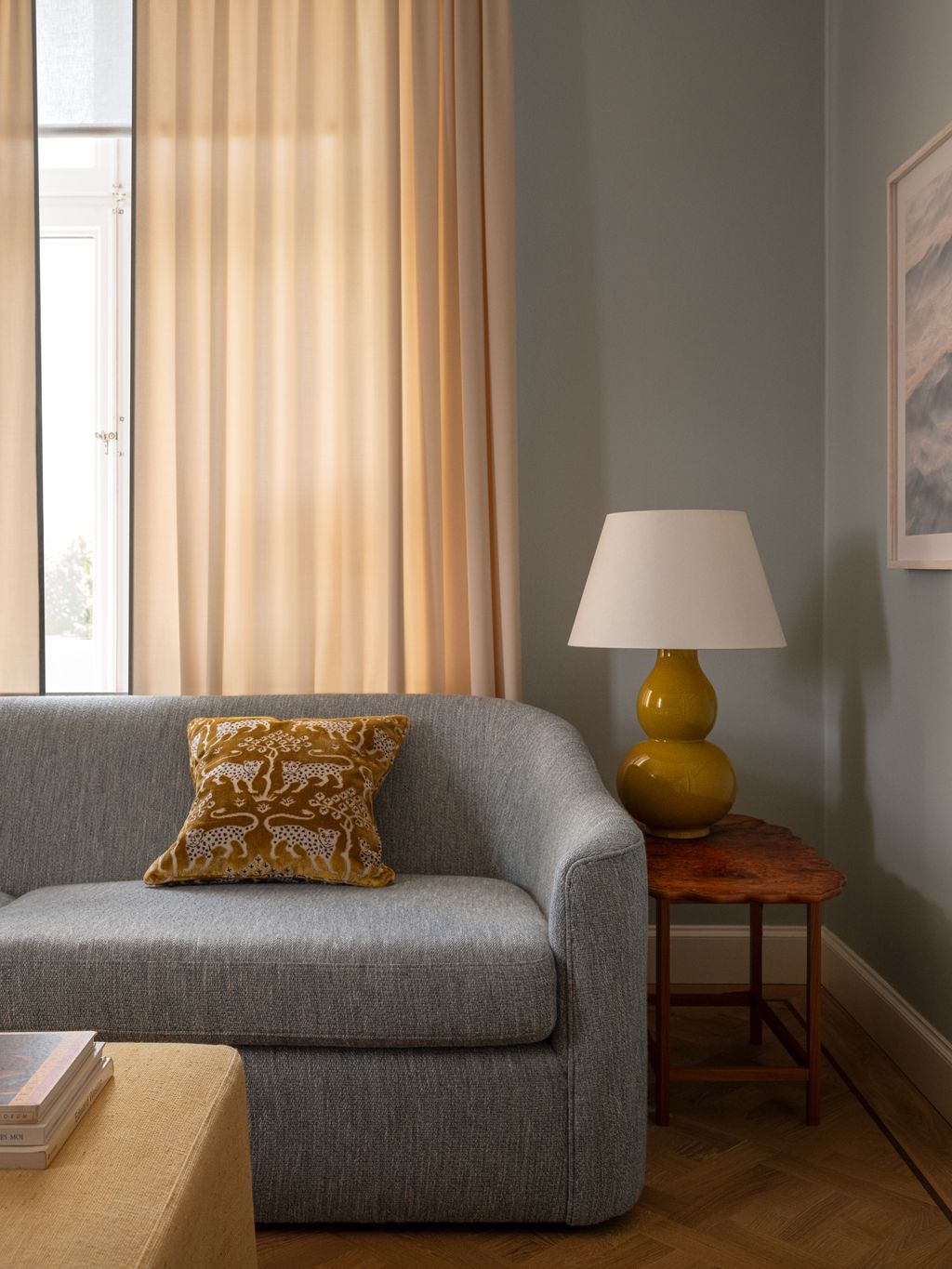 Image may contain Lamp Couch Furniture Home Decor Cushion Architecture Building Indoors Living Room Room and Art