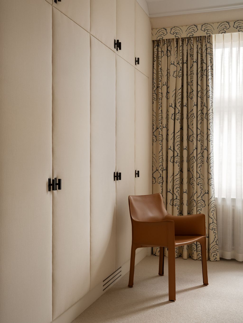 Image may contain Indoors Interior Design Chair Furniture Dressing Room Room Closet and Cupboard