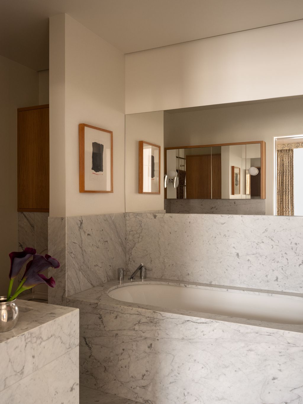 Image may contain Indoors Interior Design Bathing Bathtub Person Tub Art Painting Sink Sink Faucet and Corner