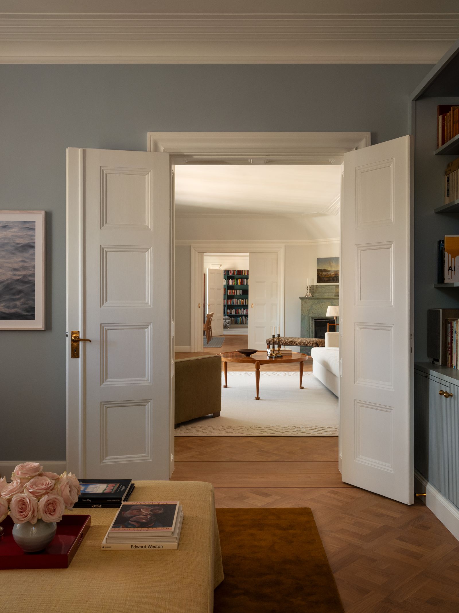 Image may contain Book Publication Door Floor Flooring Corner Lamp Art Painting Indoors Interior Design and Desk