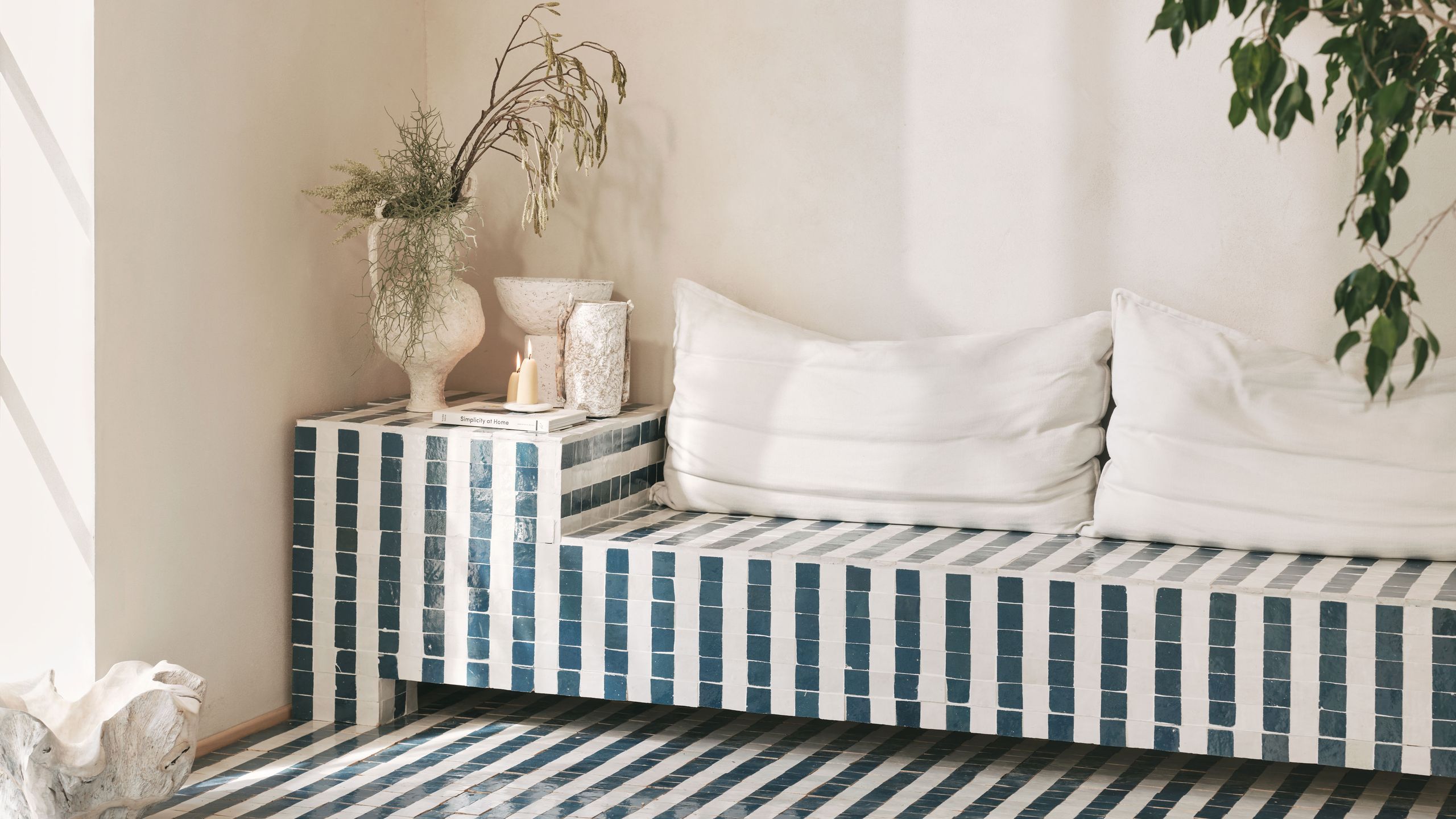 Image may contain: Home Decor, Cushion, Couch, Furniture, Rug, Pillow, Indoors, Interior Design, Architecture, and Building