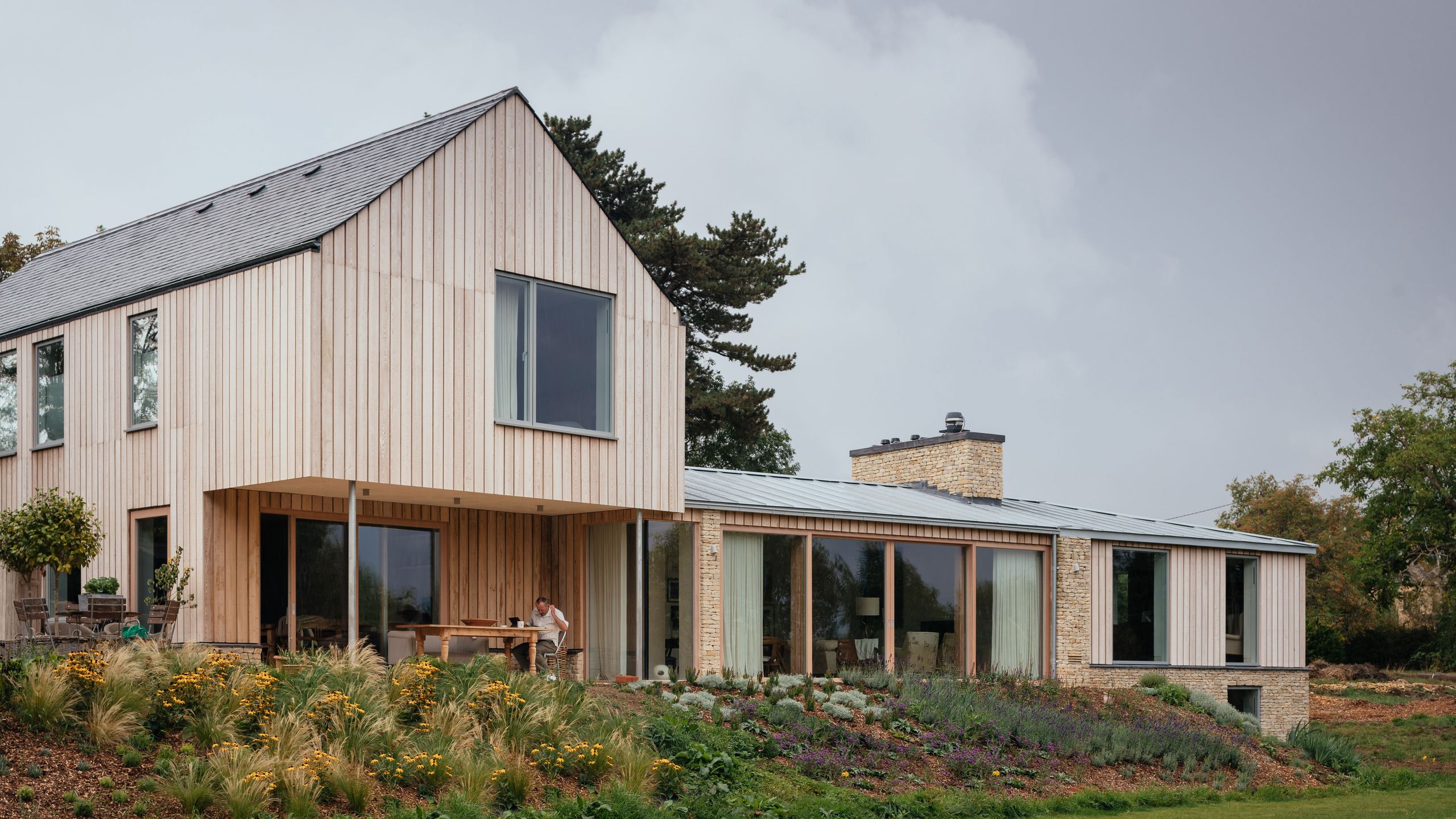 Image may contain: Indoors, Interior Design, Architecture, Building, Cottage, House, Housing, Grass, Plant, Person, and Lawn