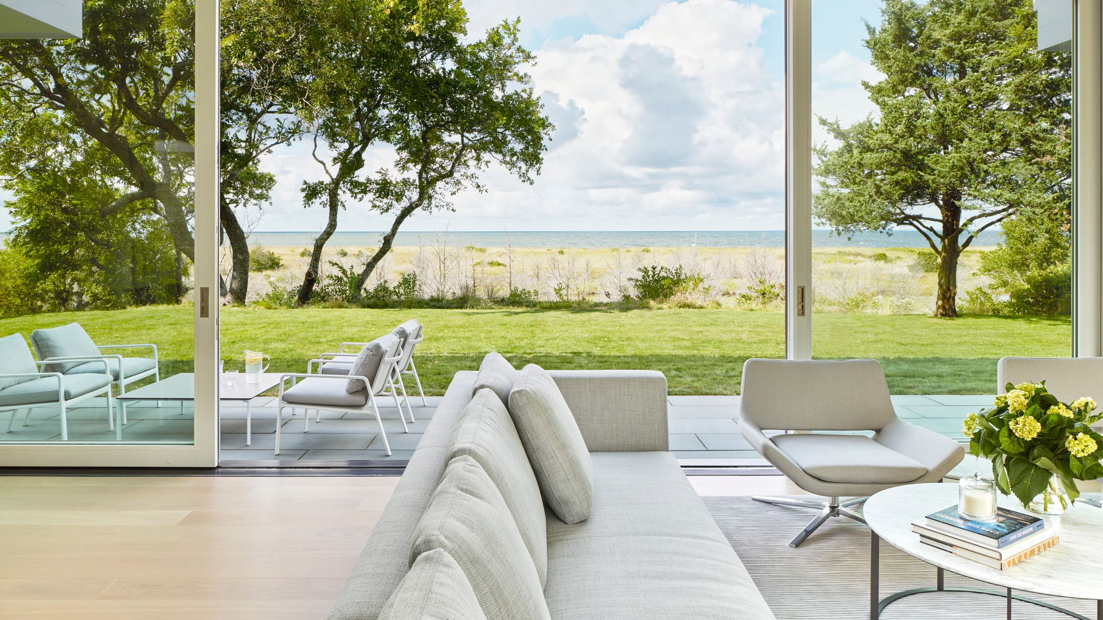 Image may contain: Nature, Outdoors, Scenery, Couch, Furniture, Chair, Desk, Table, Cup, Book, and Publication