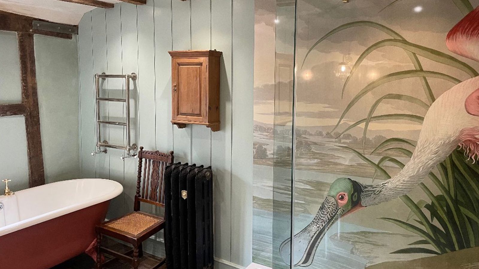 Image may contain: Indoors, Interior Design, Chair, Furniture, Bathing, Bathtub, Person, Tub, Animal, and Bird