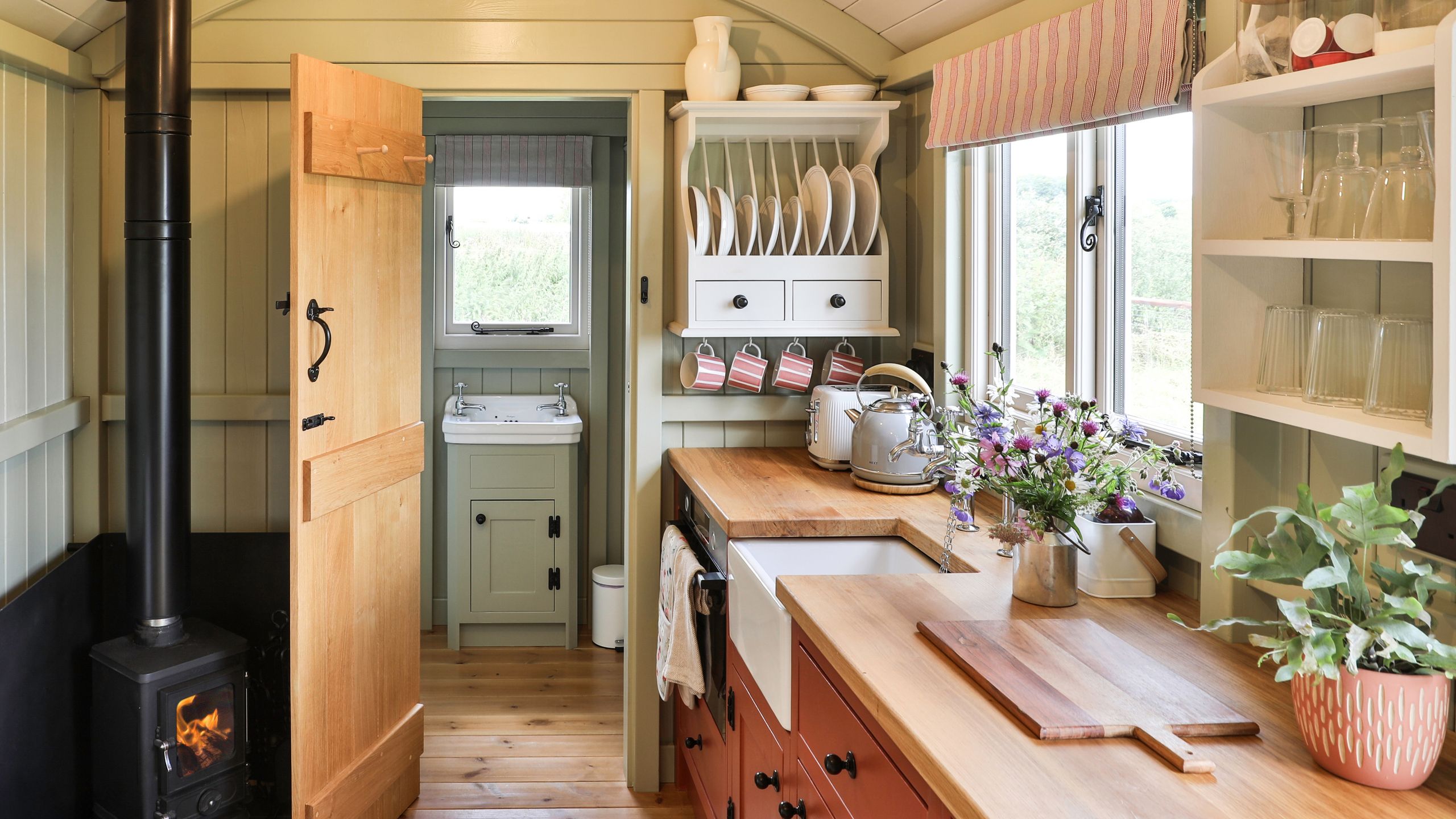 Image may contain: Indoors, Interior Design, Plant, Cup, Kitchen, Wood, and Shelf