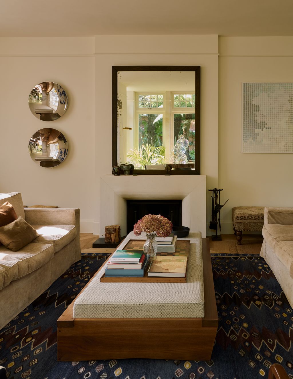 Image may contain Furniture Home Decor Couch Table Plant Person Rug Architecture Building Indoors and Living Room