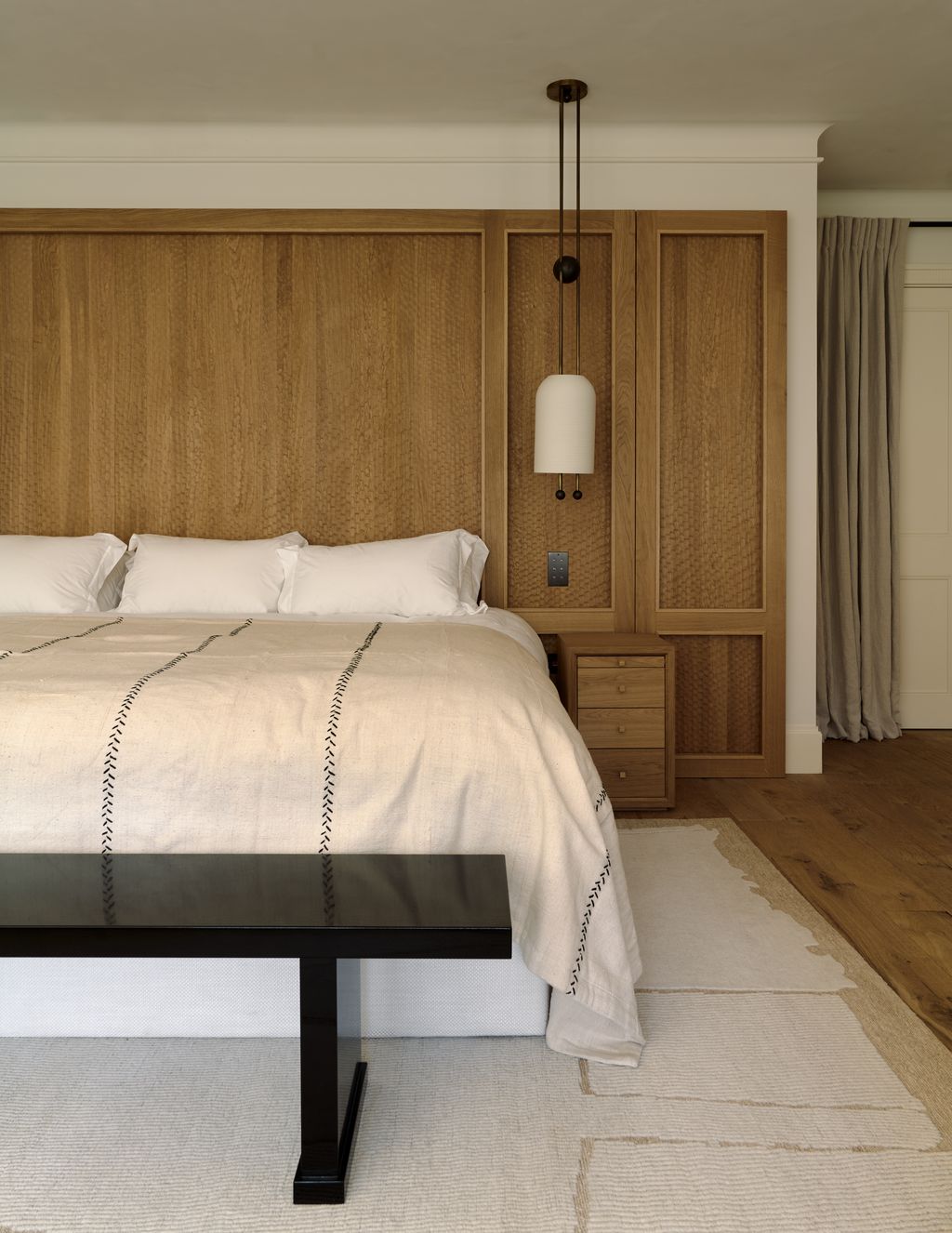 Image may contain Indoors Interior Design Wood Panels Bed Furniture and Lamp