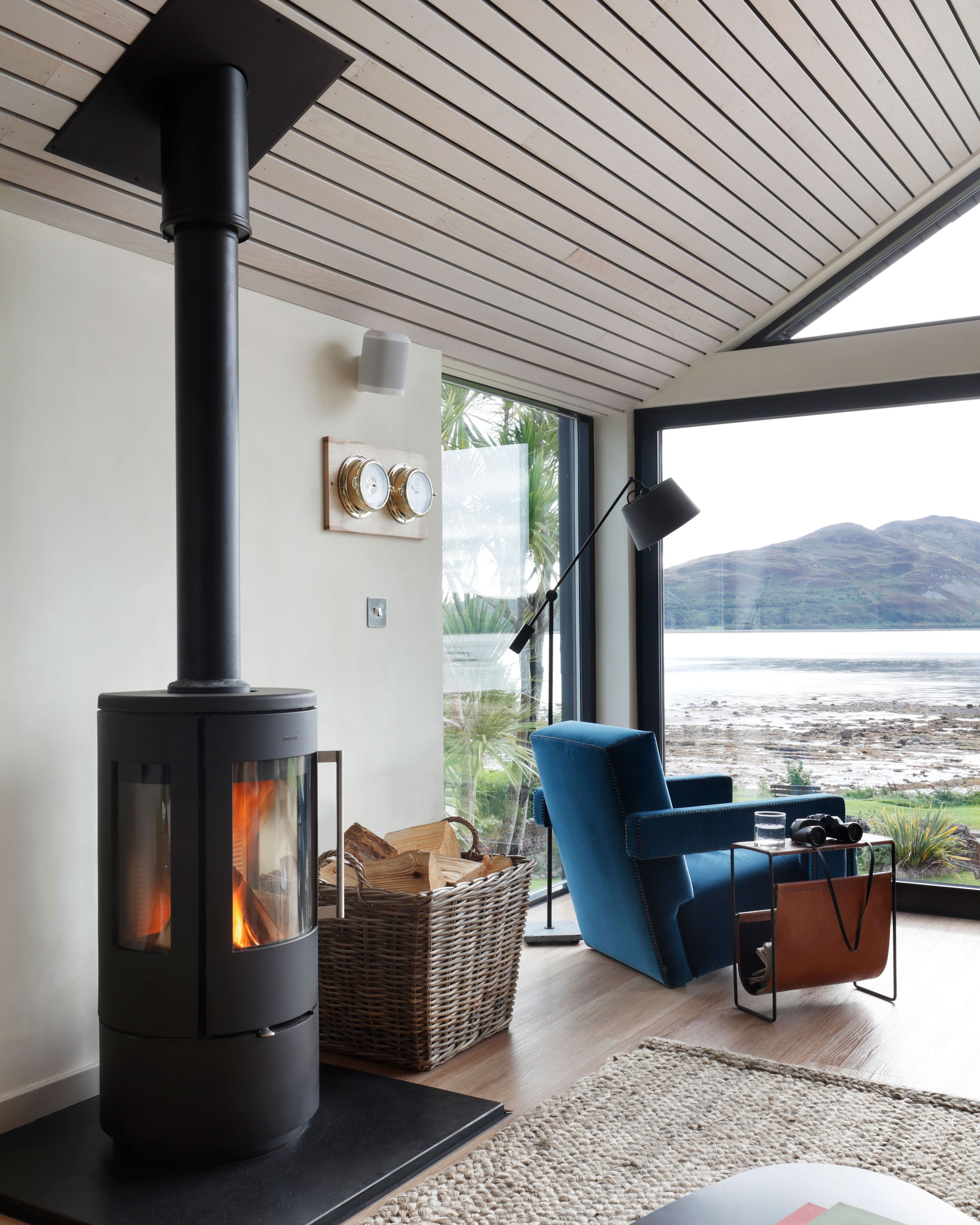 Image may contain: Indoors, Interior Design, Fireplace, Cup, Home Decor, Rug, Architecture, Building, and Furniture