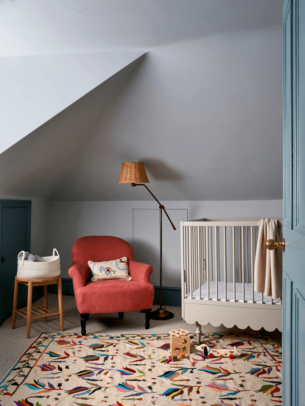 Image may contain Home Decor Lamp Crib Furniture Infant Bed Rug Indoors and Chair