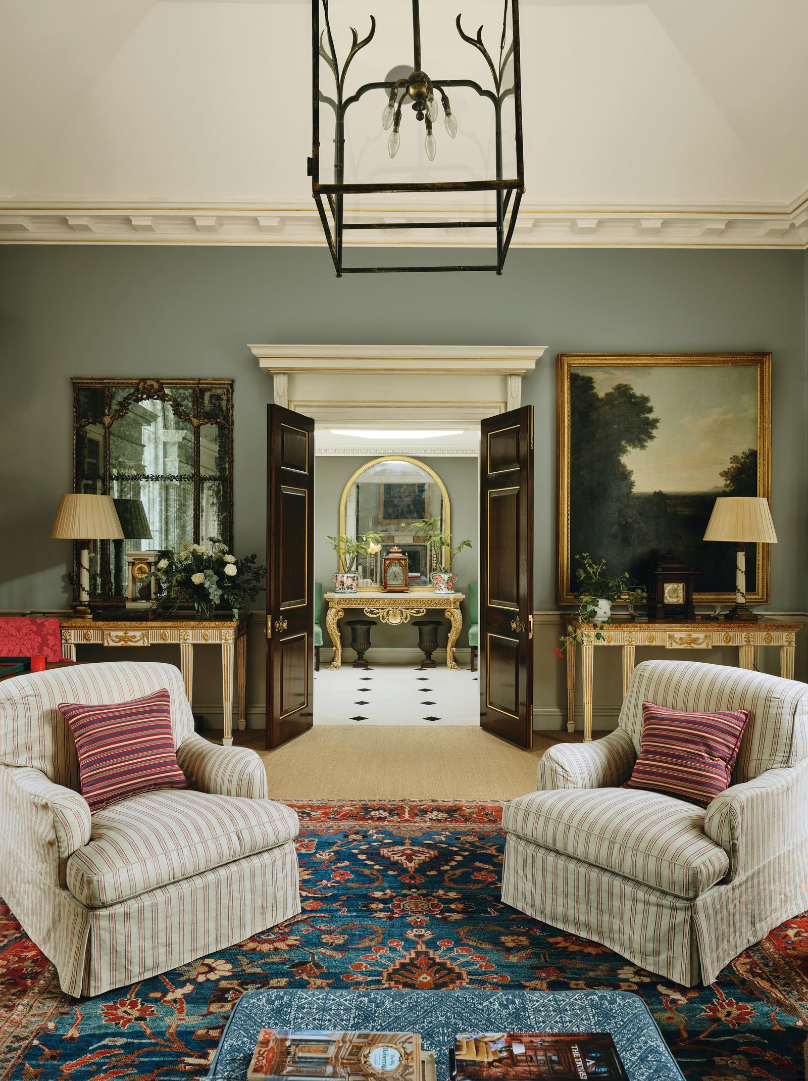 Image may contain Home Decor Lamp Desk Furniture Table Architecture Building Indoors Living Room Room and Plant