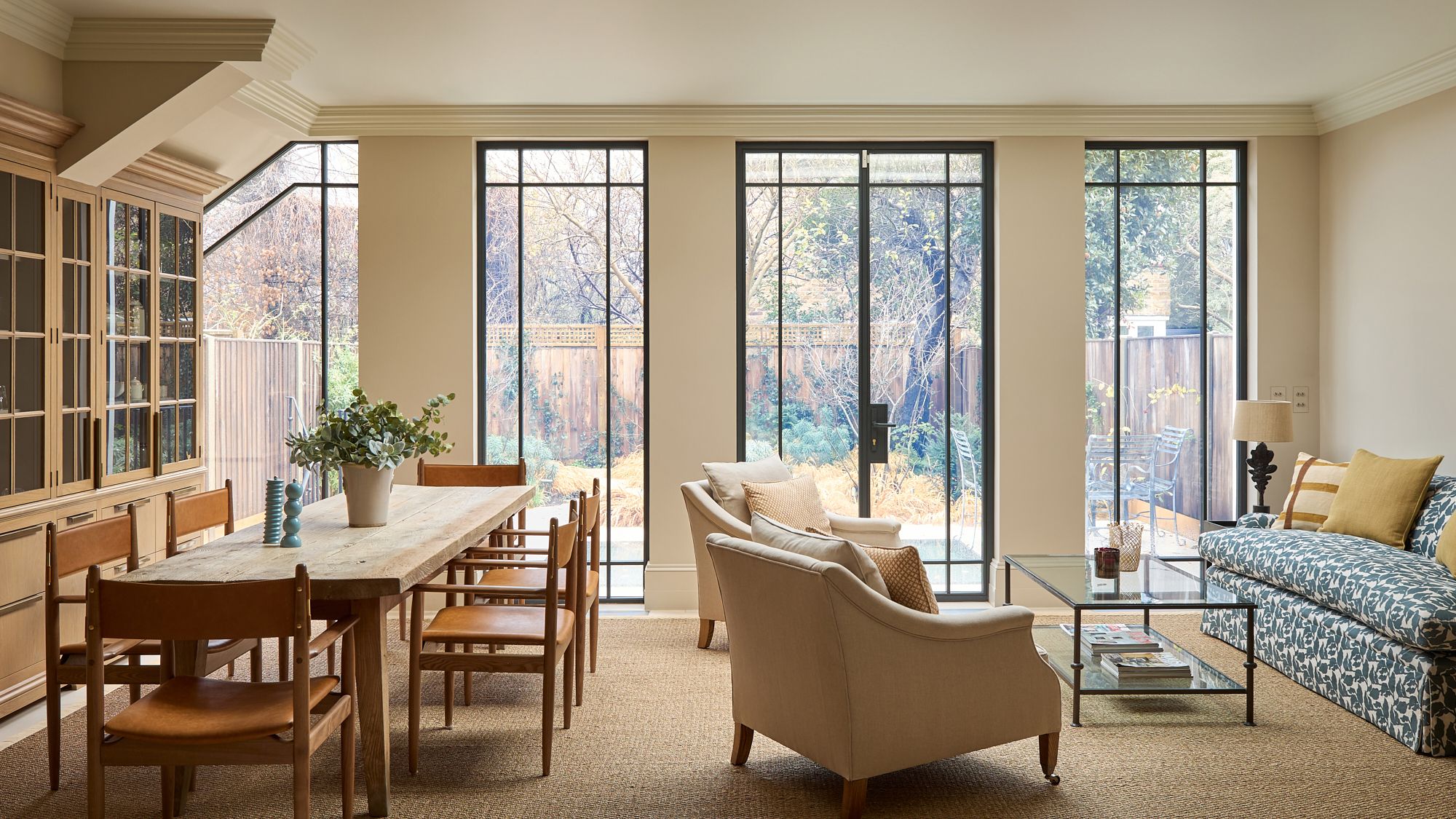 Image may contain: Plant, Lamp, Furniture, Table, French Window, Window, Chair, Couch, Desk, Door, Home Decor, and Cup