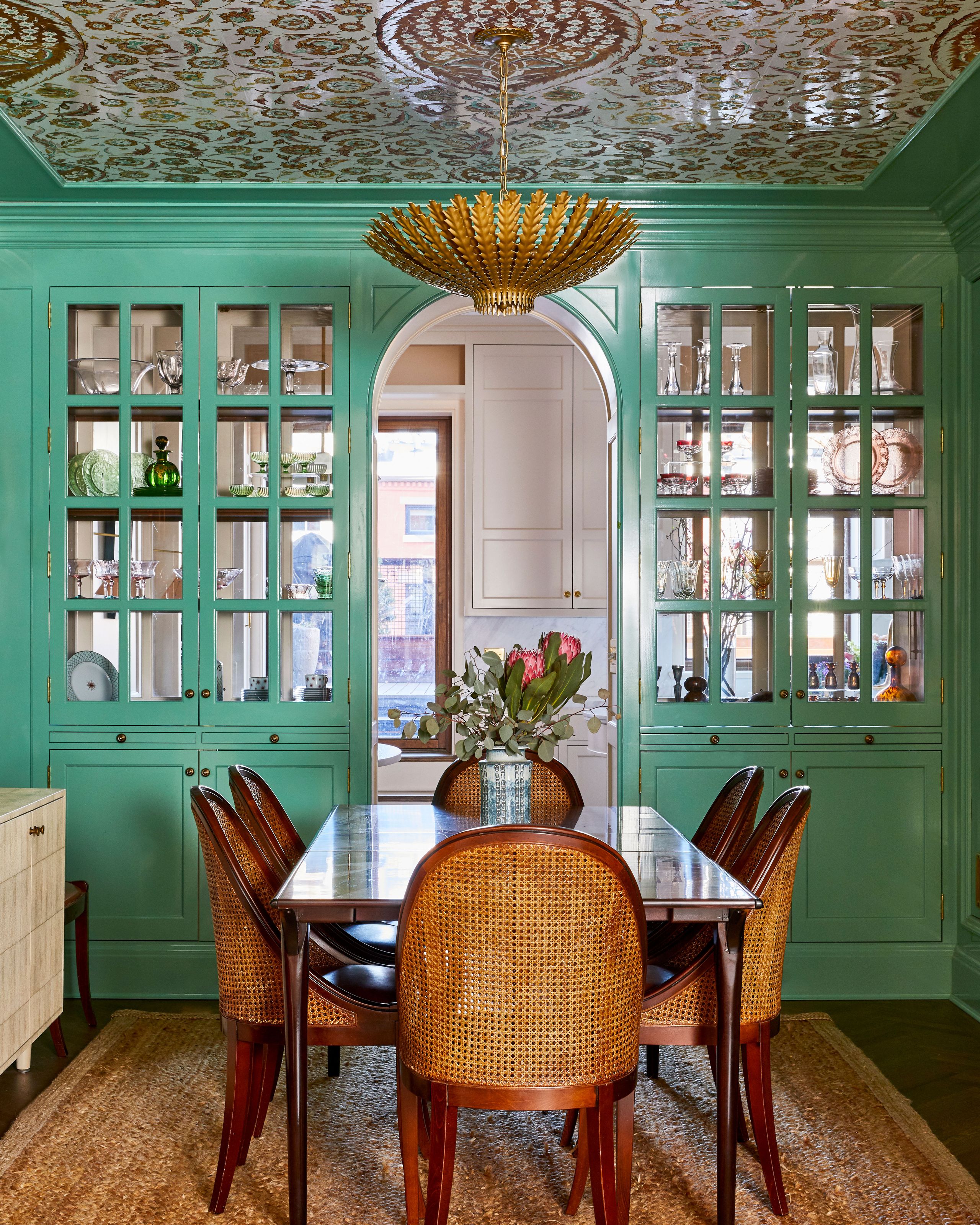 Image may contain: Architecture, Building, Dining Room, Dining Table, Furniture, Indoors, Room, Table, Chandelier, and Lamp