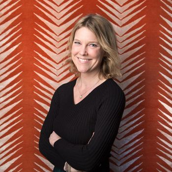 Image may contain: Face, Happy, Head, Person, Smile, Photography, Portrait, Accessories, Jewelry, Necklace, and Adult