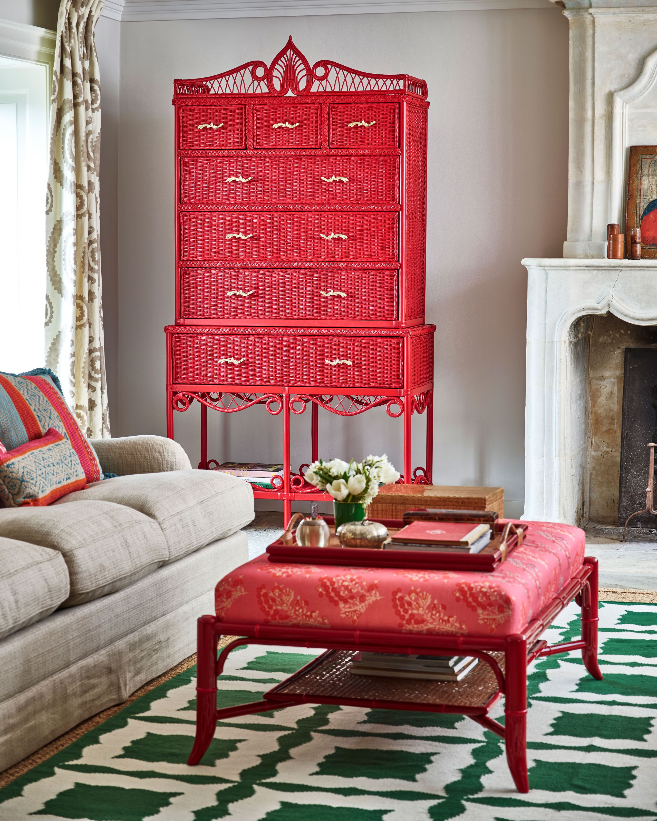 Image may contain: Furniture, Home Decor, Rug, Couch, Candle, and Person