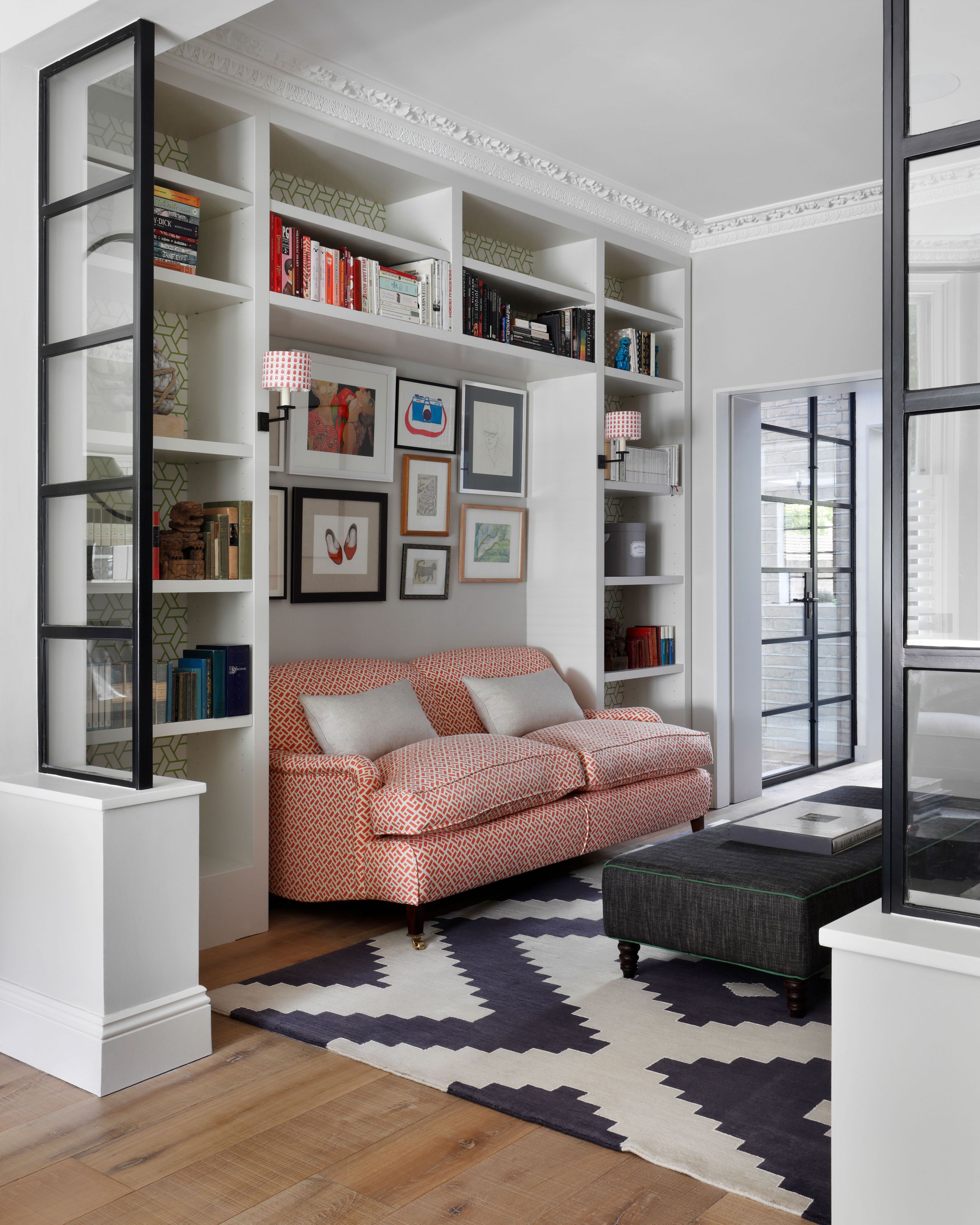 Image may contain: Home Decor, Architecture, Building, Furniture, Indoors, Living Room, Room, Rug, Couch, Lamp, and Art