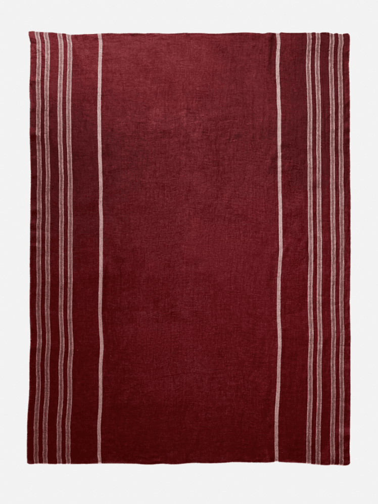 Image may contain Home Decor Rug Maroon Clothing and Shirt