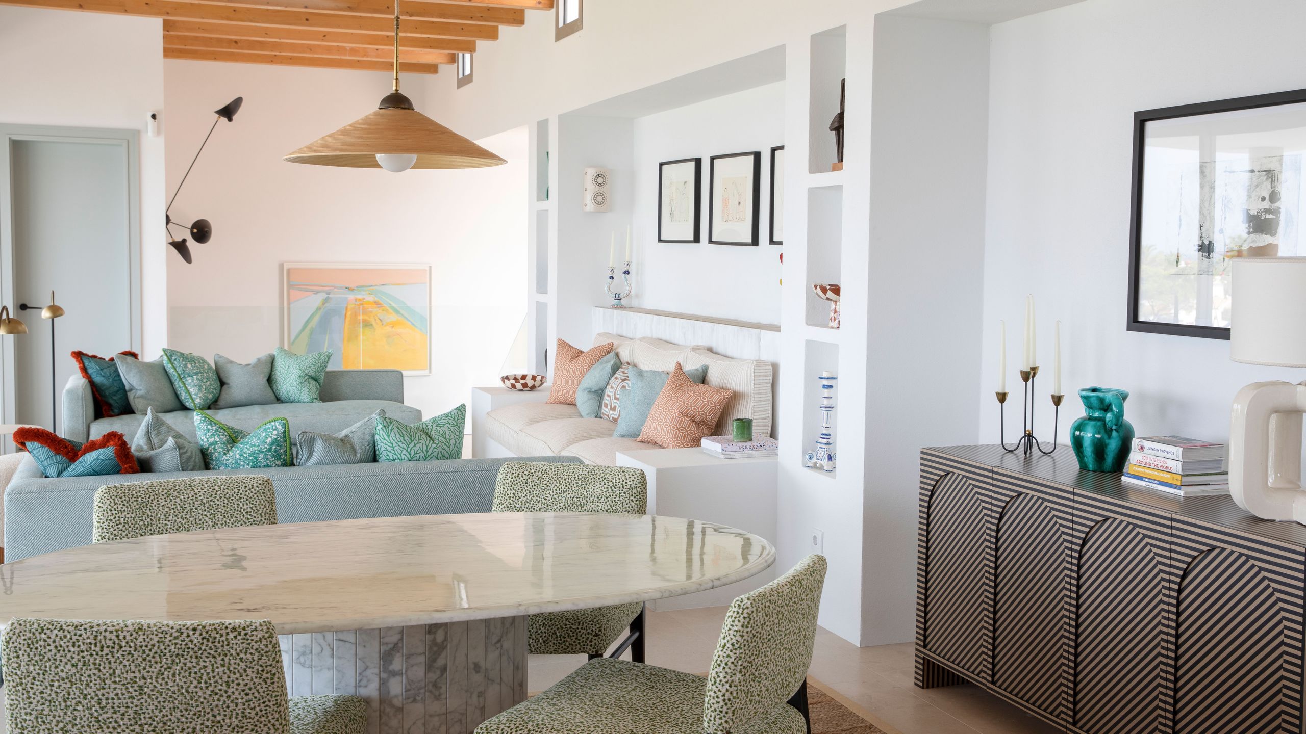 Image may contain: Furniture, Table, Architecture, Building, Dining Room, Dining Table, Indoors, Room, Home Decor, and Couch