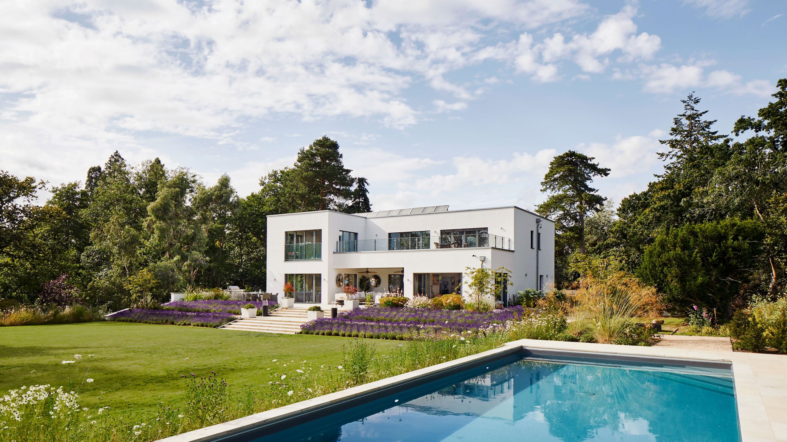 Image may contain: Architecture, Building, House, Housing, Villa, Grass, Plant, Pool, Water, and Outdoors