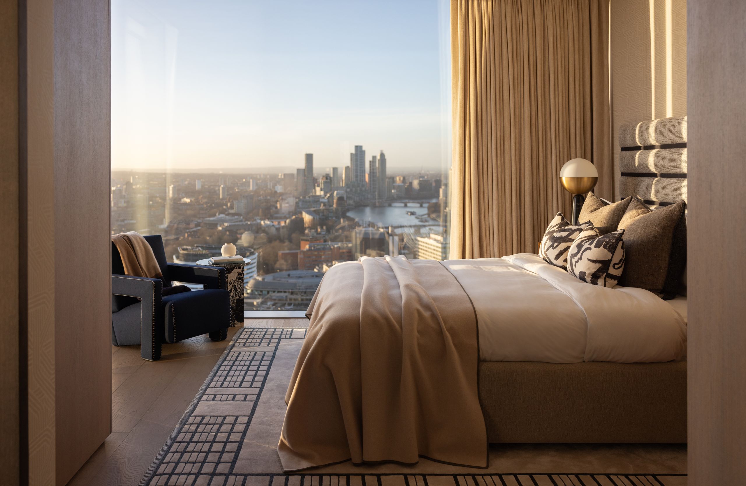 Image may contain: Architecture, Building, Penthouse, Balcony, Lamp, Bed, Furniture, Indoors, Interior Design, and Chair