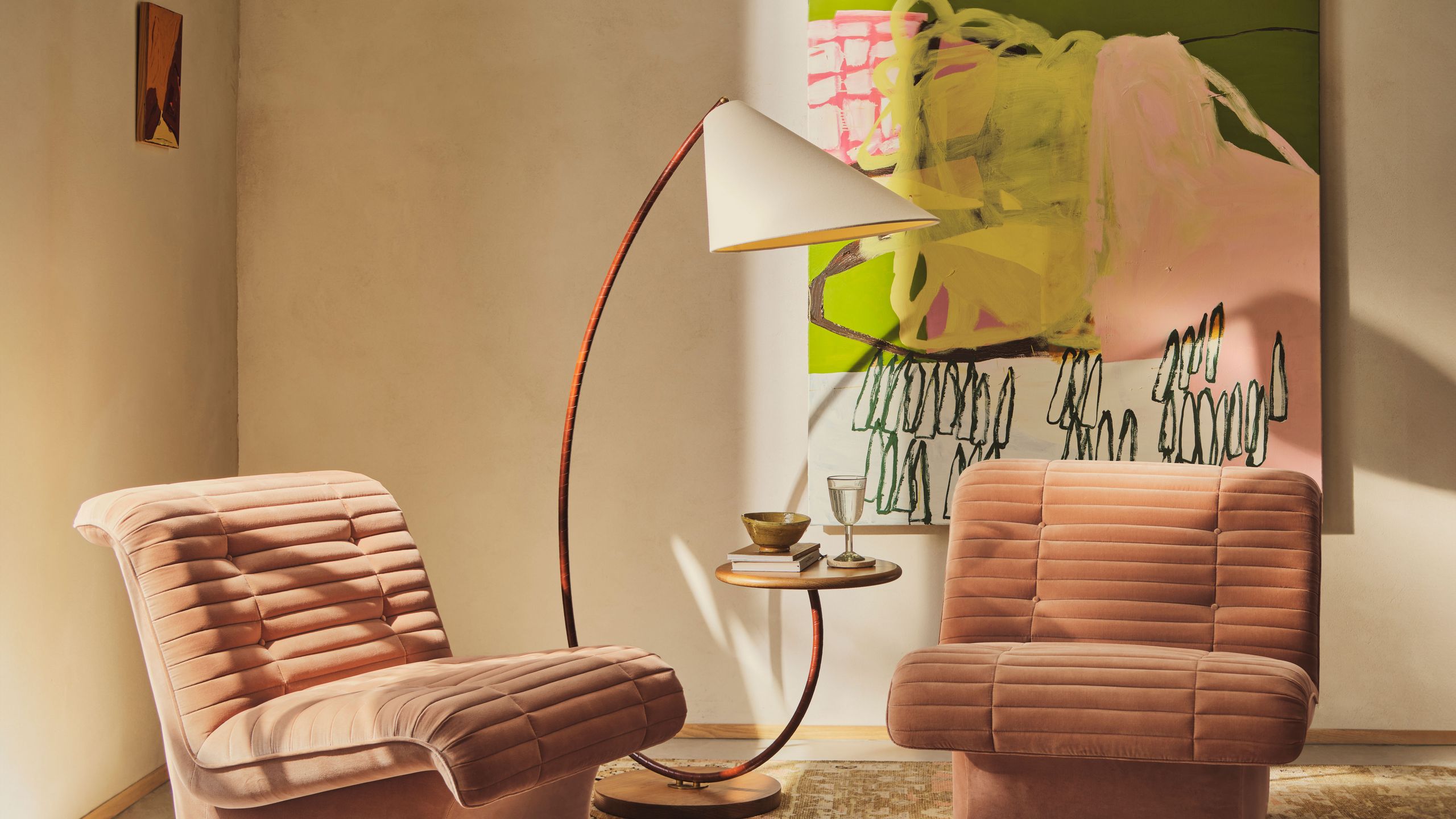 Image may contain: Lamp, Furniture, Chair, Couch, Armchair, Floor Lamp, Home Decor, and Rug