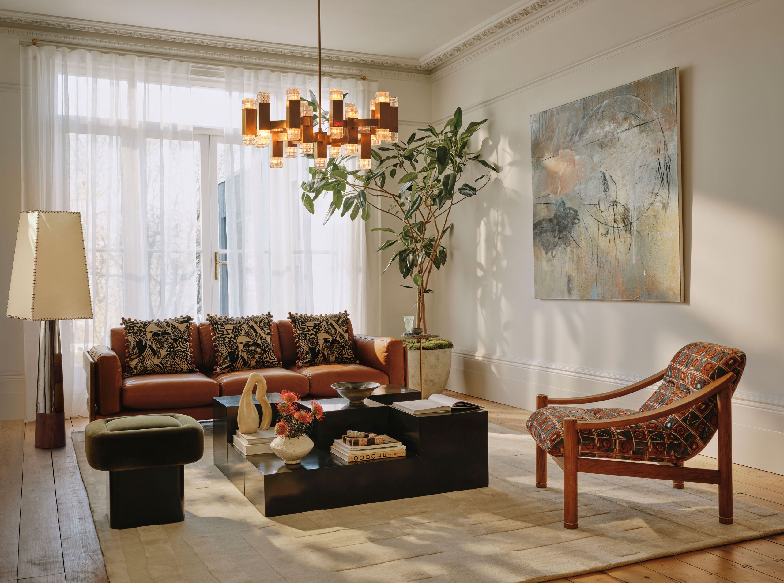 Image may contain: Home Decor, Lamp, Chair, Furniture, Plant, Couch, Architecture, Building, Indoors, Living Room, and Room