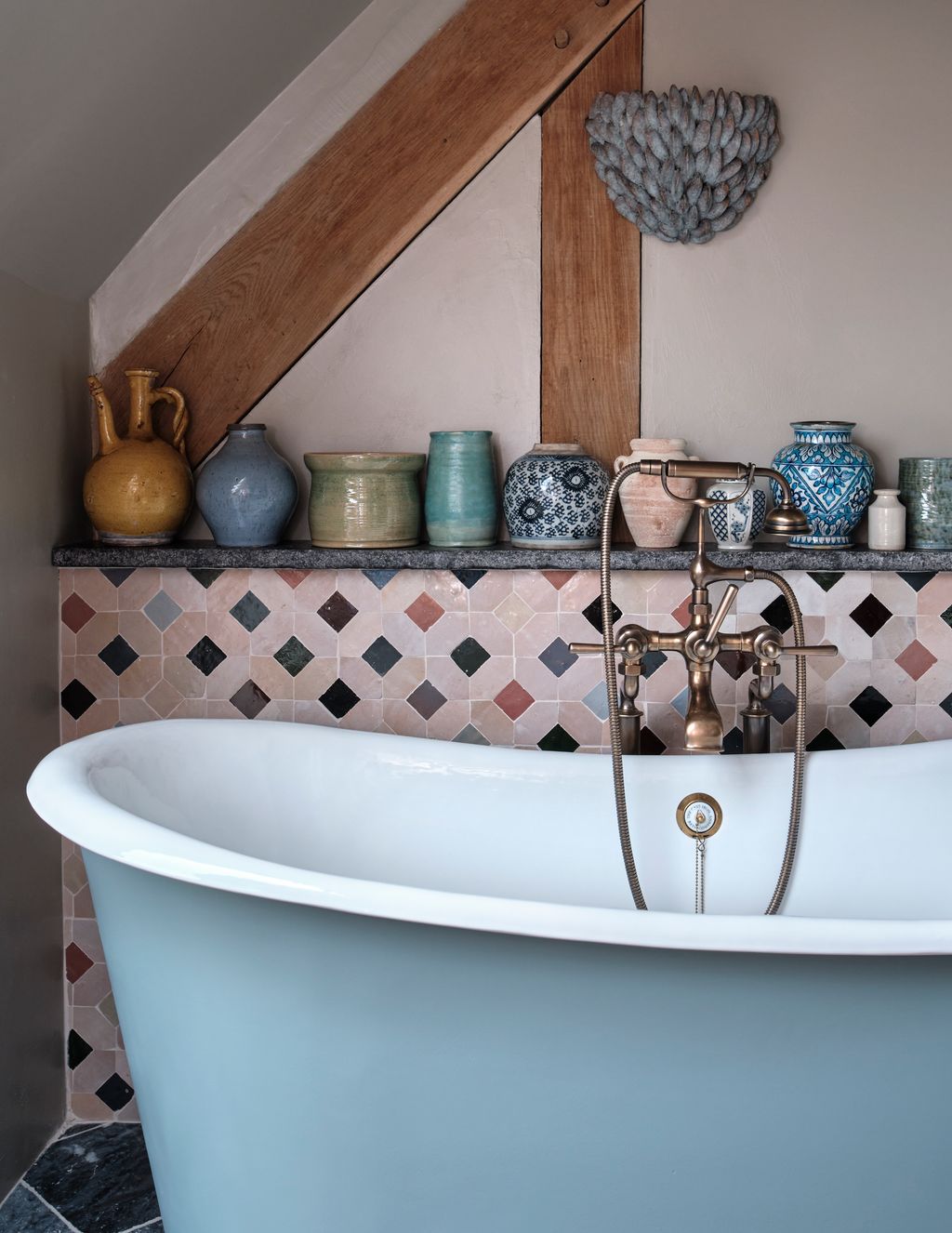 Image may contain Bathing Bathtub Person Tub Indoors Interior Design Cup Sink and Sink Faucet