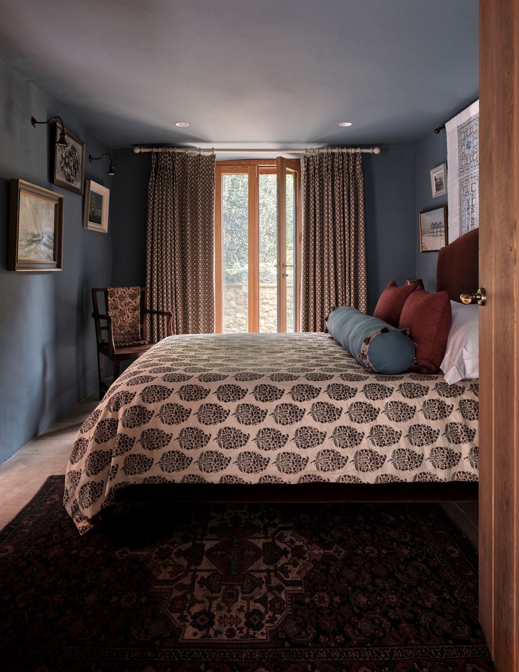 Image may contain Lamp Chair Furniture Bed Home Decor Rug Art Painting Indoors Interior Design Bedroom and Room