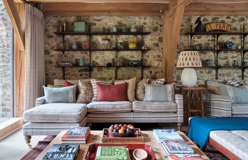 Image may contain Home Decor Lamp Cushion Couch Furniture Table Architecture Building Indoors Living Room and Room