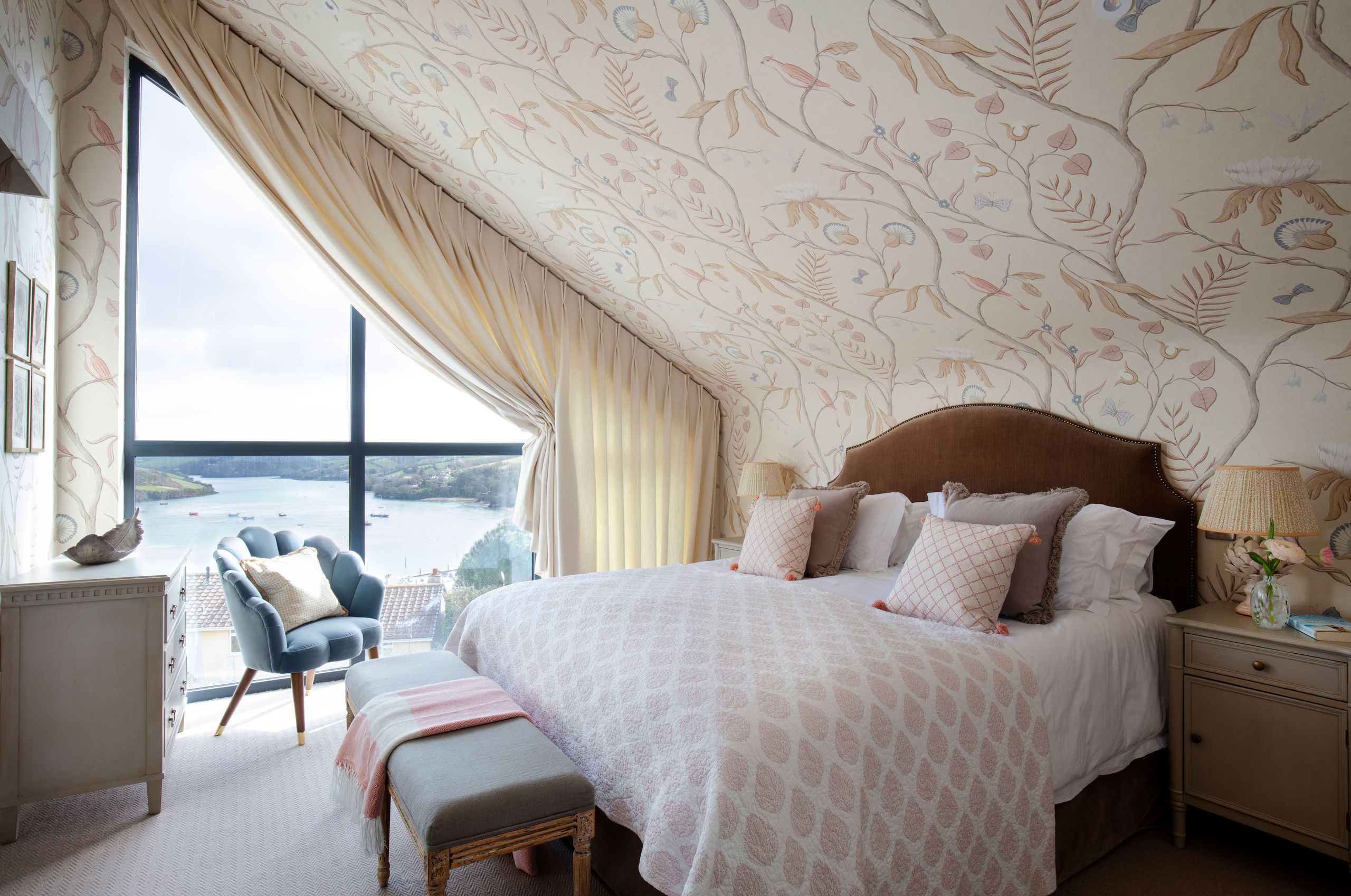 Image may contain: Lamp, Bed, Furniture, Home Decor, Indoors, Interior Design, Cushion, Chair, Bedroom, and Room