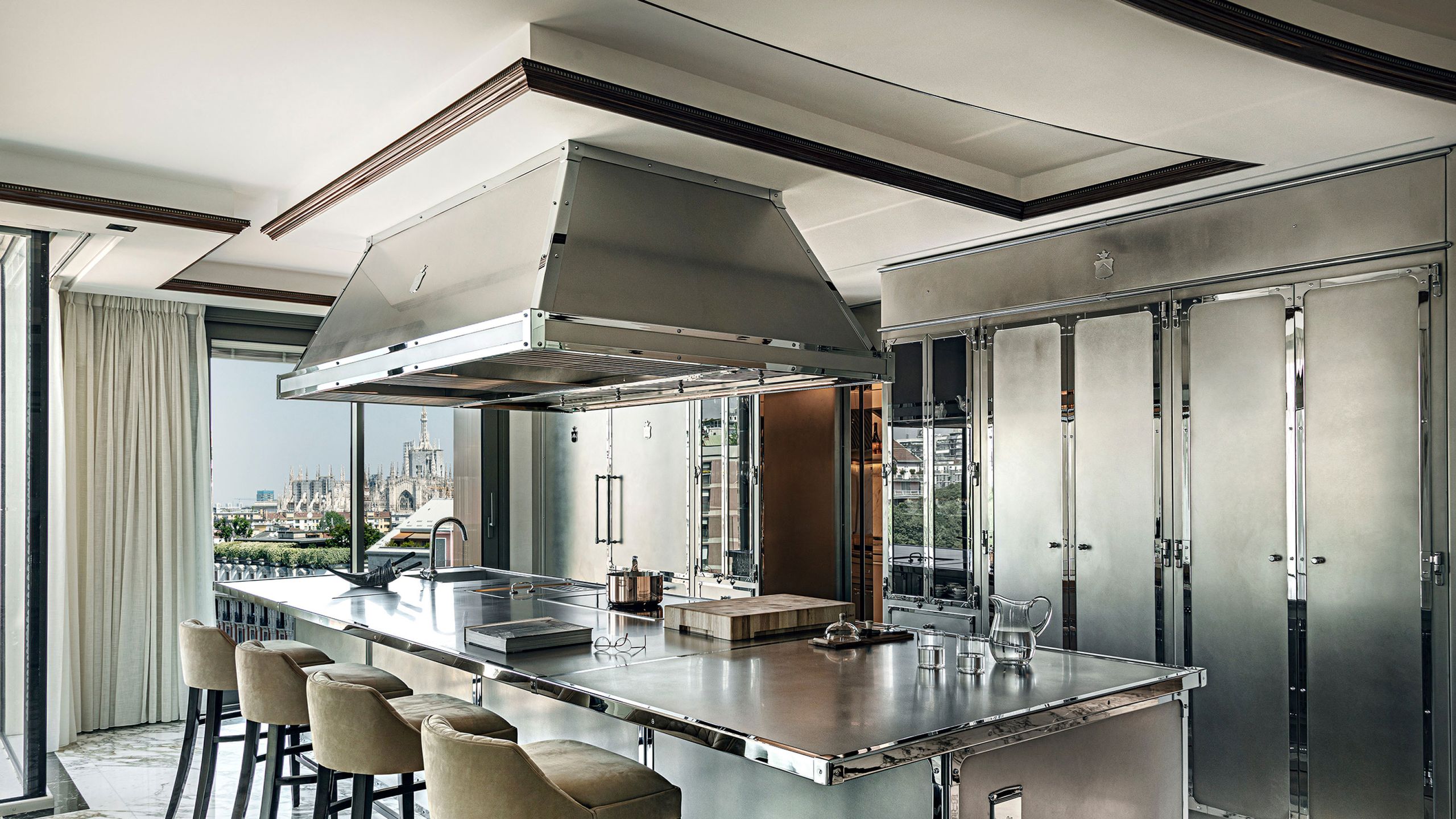 Image may contain: Indoors, Kitchen, Kitchen Island, Interior Design, Dining Table, Furniture, Table, and Chair