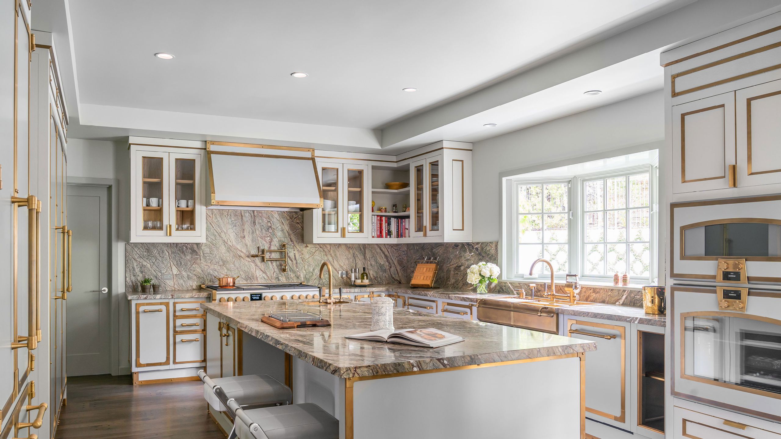 Image may contain: Indoors, Interior Design, Kitchen, Kitchen Island, Book, and Publication