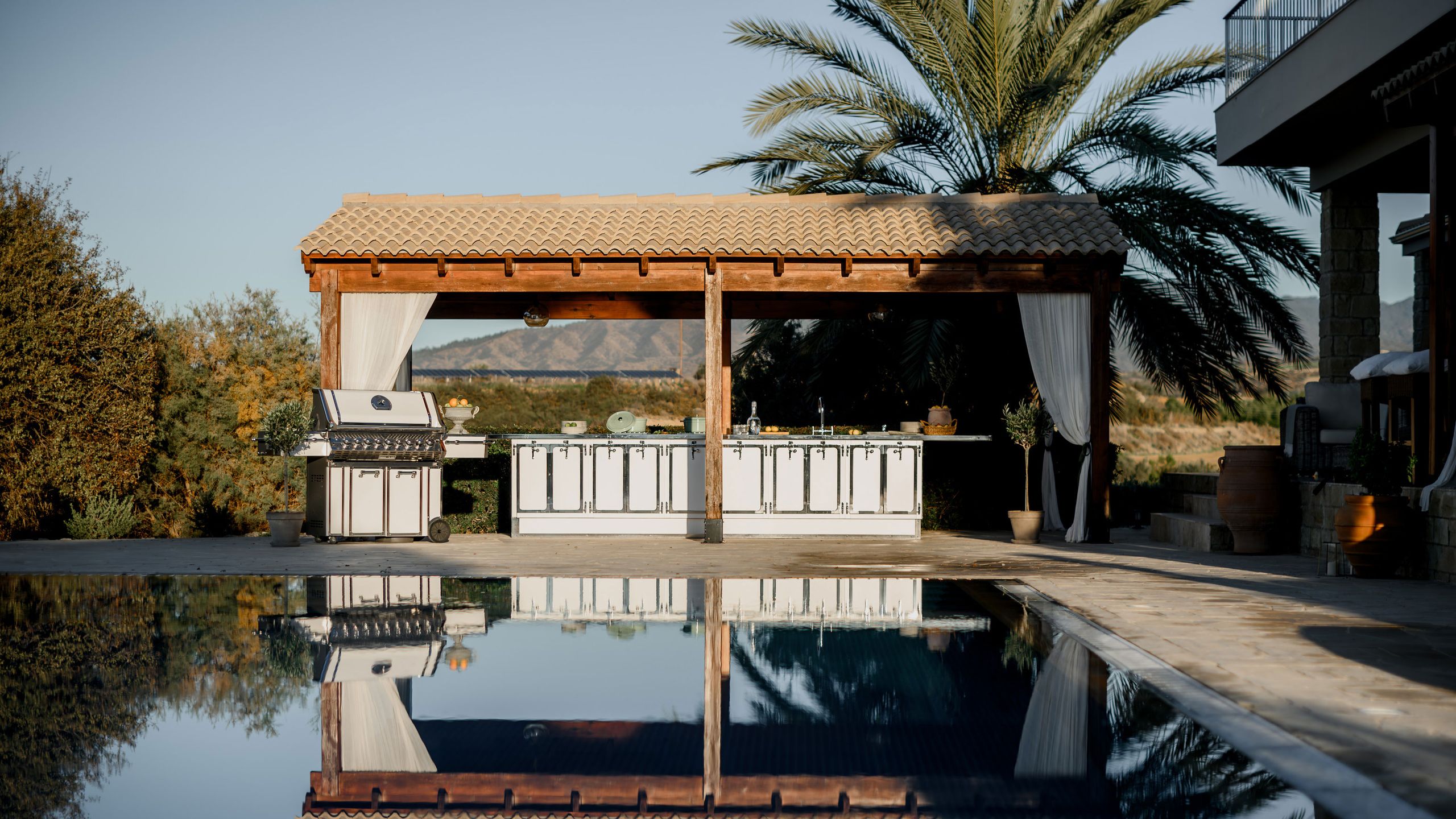 Image may contain: Architecture, Building, House, Housing, Villa, Plant, Pool, Water, Nature, Outdoors, and Scenery