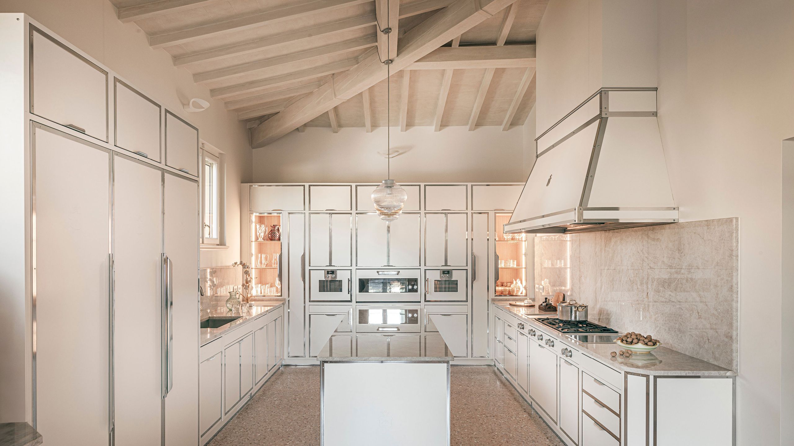 Image may contain: Indoors, Interior Design, Kitchen, Cooktop, Floor, and Lamp