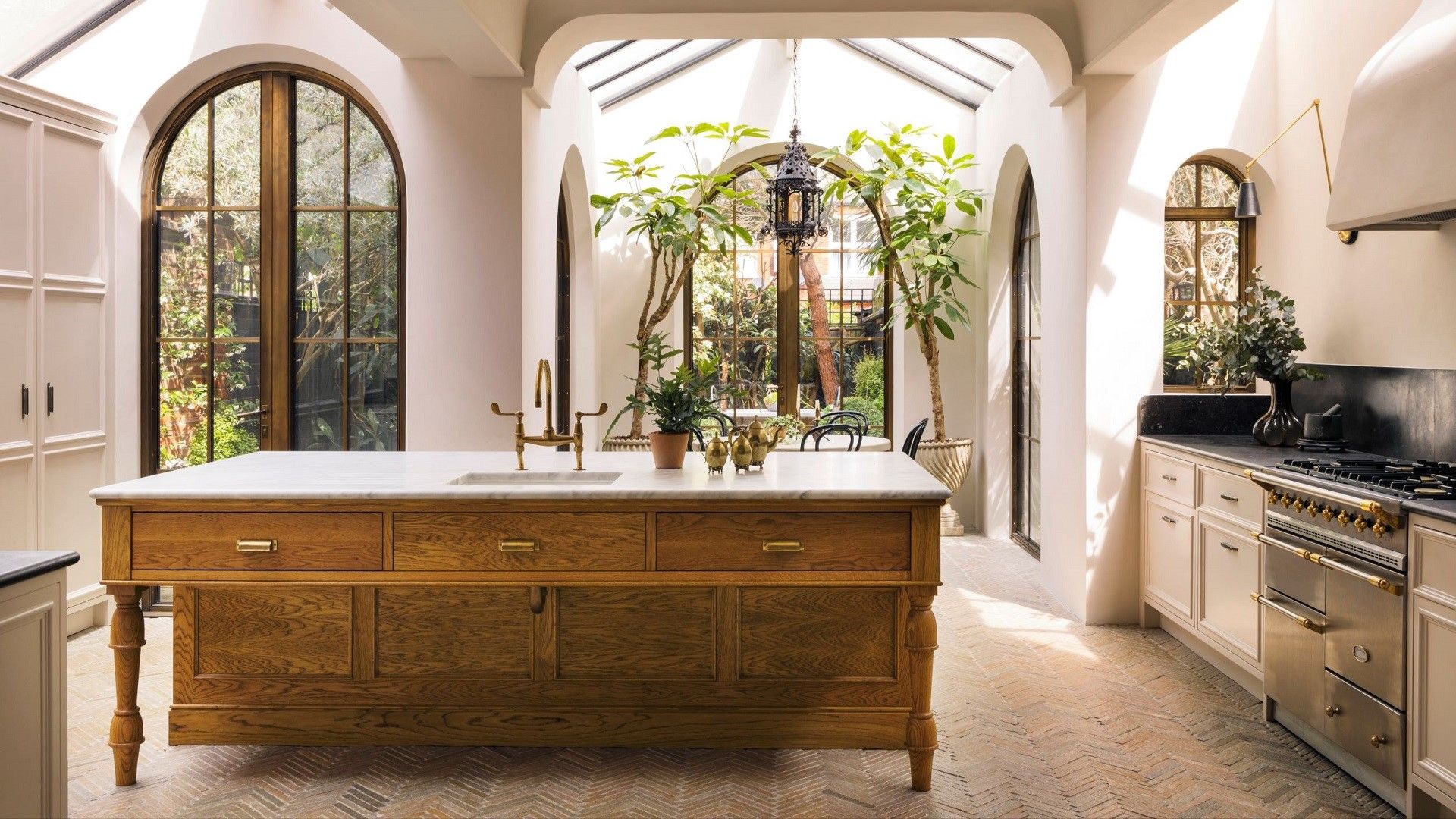 Image may contain: Indoors, Interior Design, Furniture, Sideboard, Plant, Sink, Lamp, Kitchen, and Sink Faucet