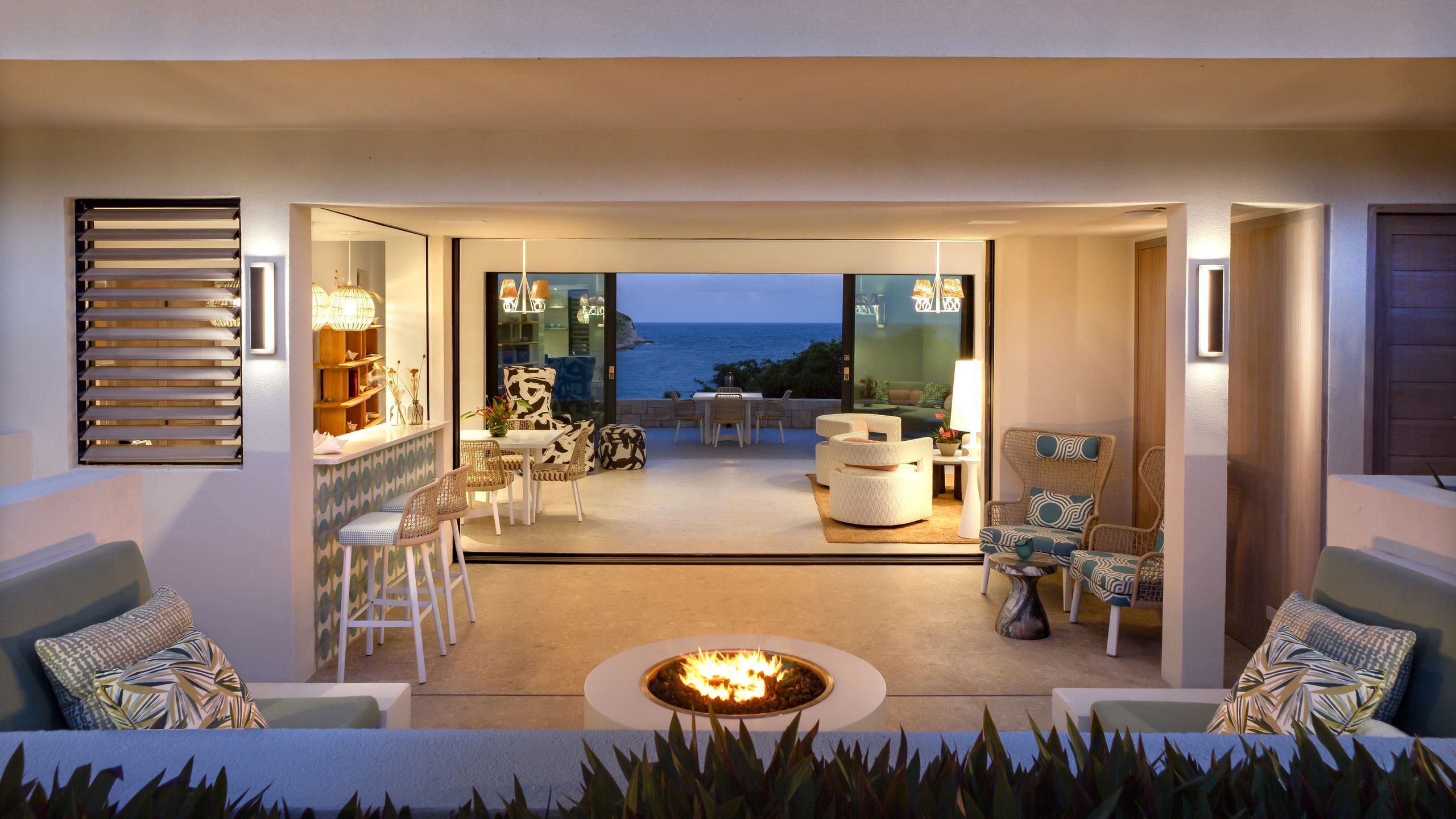 Image may contain: Architecture, Building, Furniture, Indoors, Living Room, Room, Chair, Home Decor, Rug, Table, and Couch