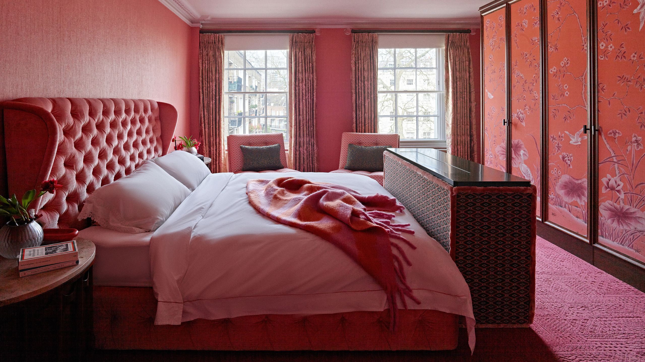 Image may contain: Indoors, Interior Design, Home Decor, Bed, Furniture, Chair, Plant, Book, Publication, Bedroom, and Room