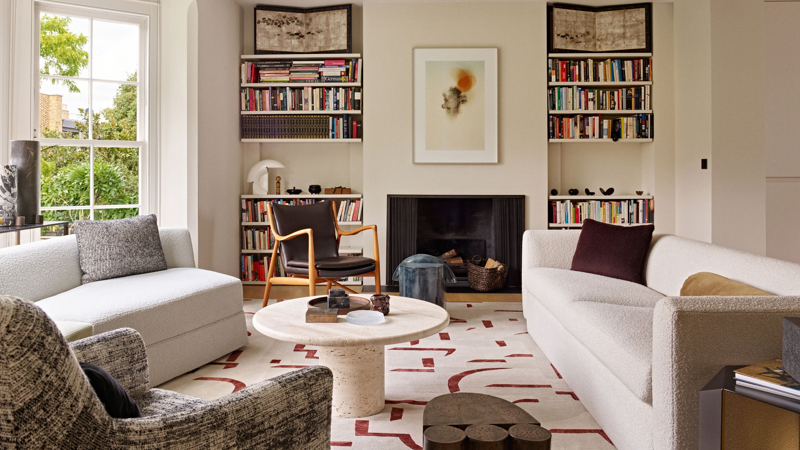 Image may contain: Home Decor, Rug, Architecture, Building, Furniture, Indoors, Living Room, Room, Table, Chair, and Couch