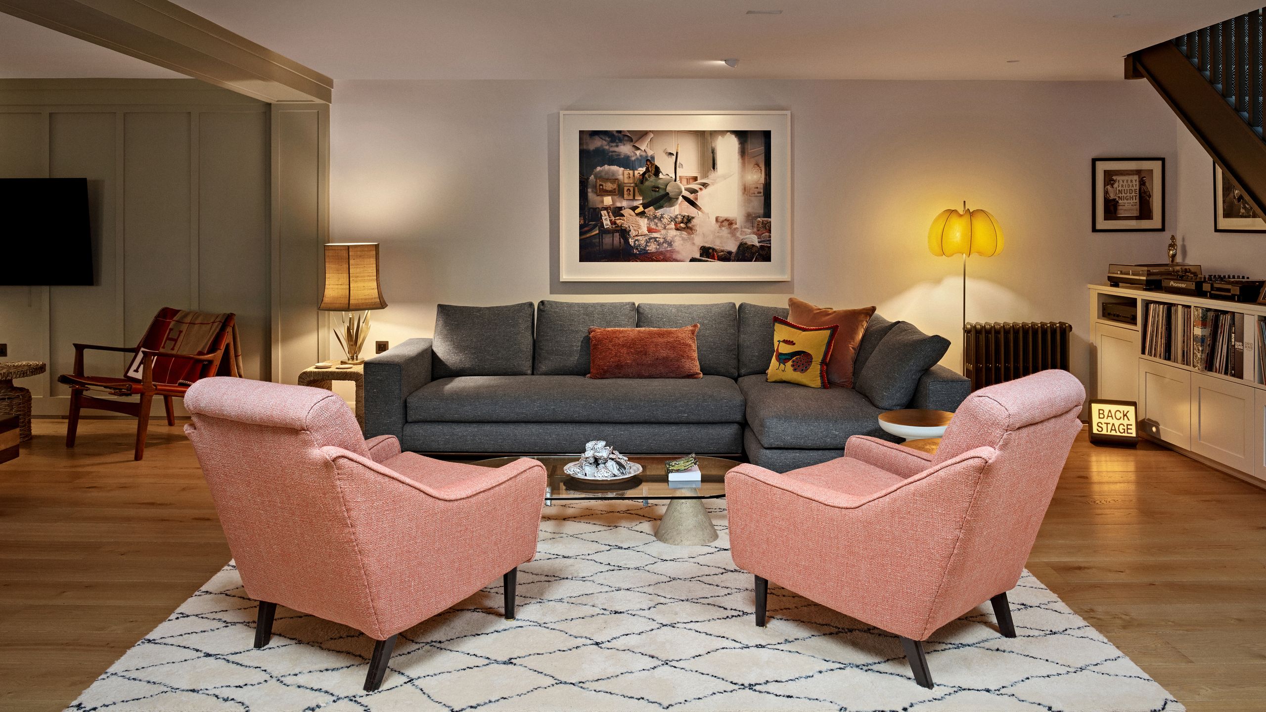 Image may contain: Lamp, Home Decor, Chair, Furniture, Couch, Architecture, Building, Indoors, Living Room, Room, and Art