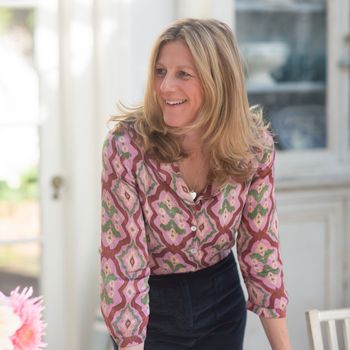 Image may contain: Blouse, Clothing, Sleeve, Adult, Person, Blonde, Hair, Accessories, Jewelry, Necklace, and Long Sleeve