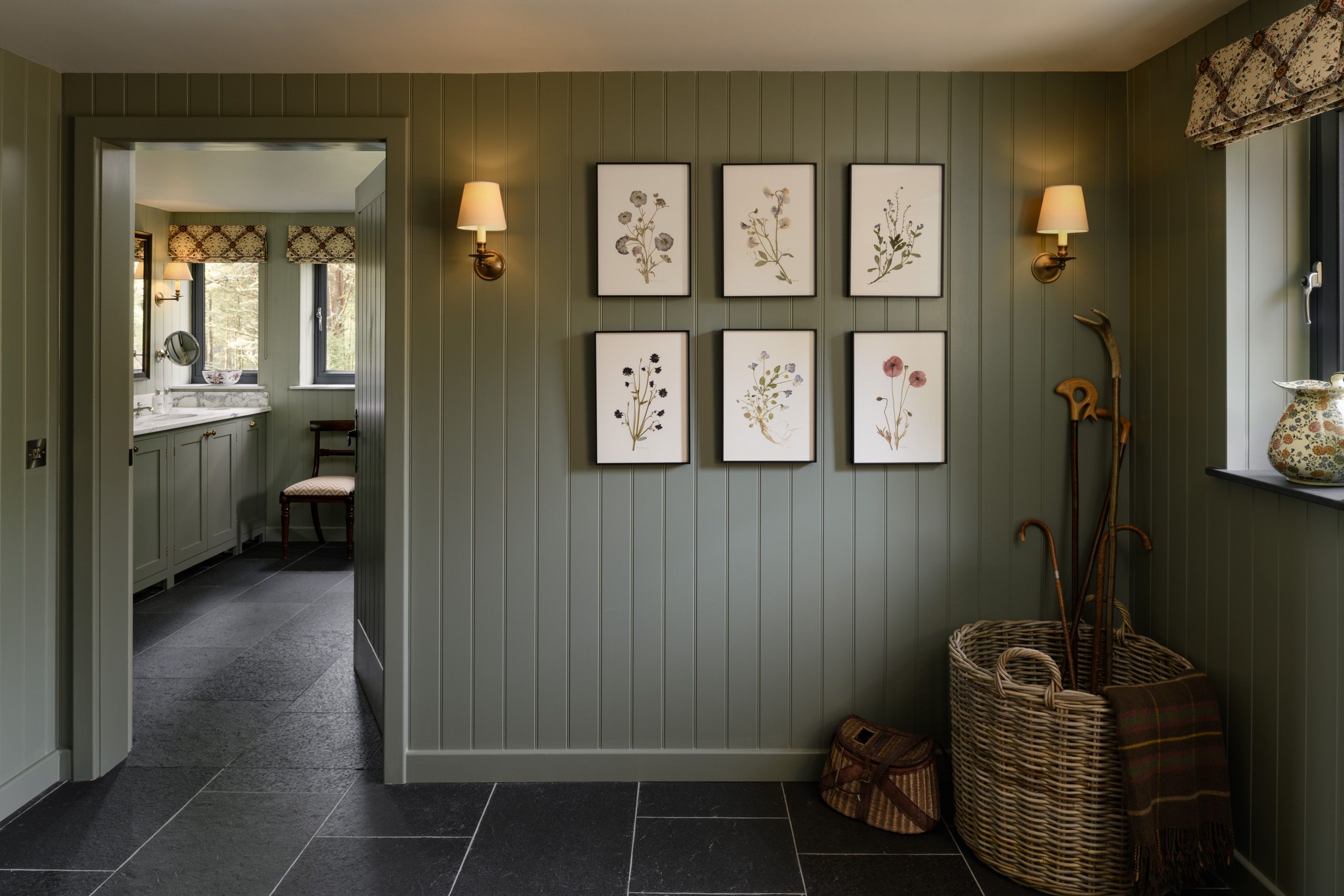 Image may contain: Indoors, Interior Design, Floor, Lamp, Accessories, Bag, Handbag, Chair, Furniture, Art, and Painting