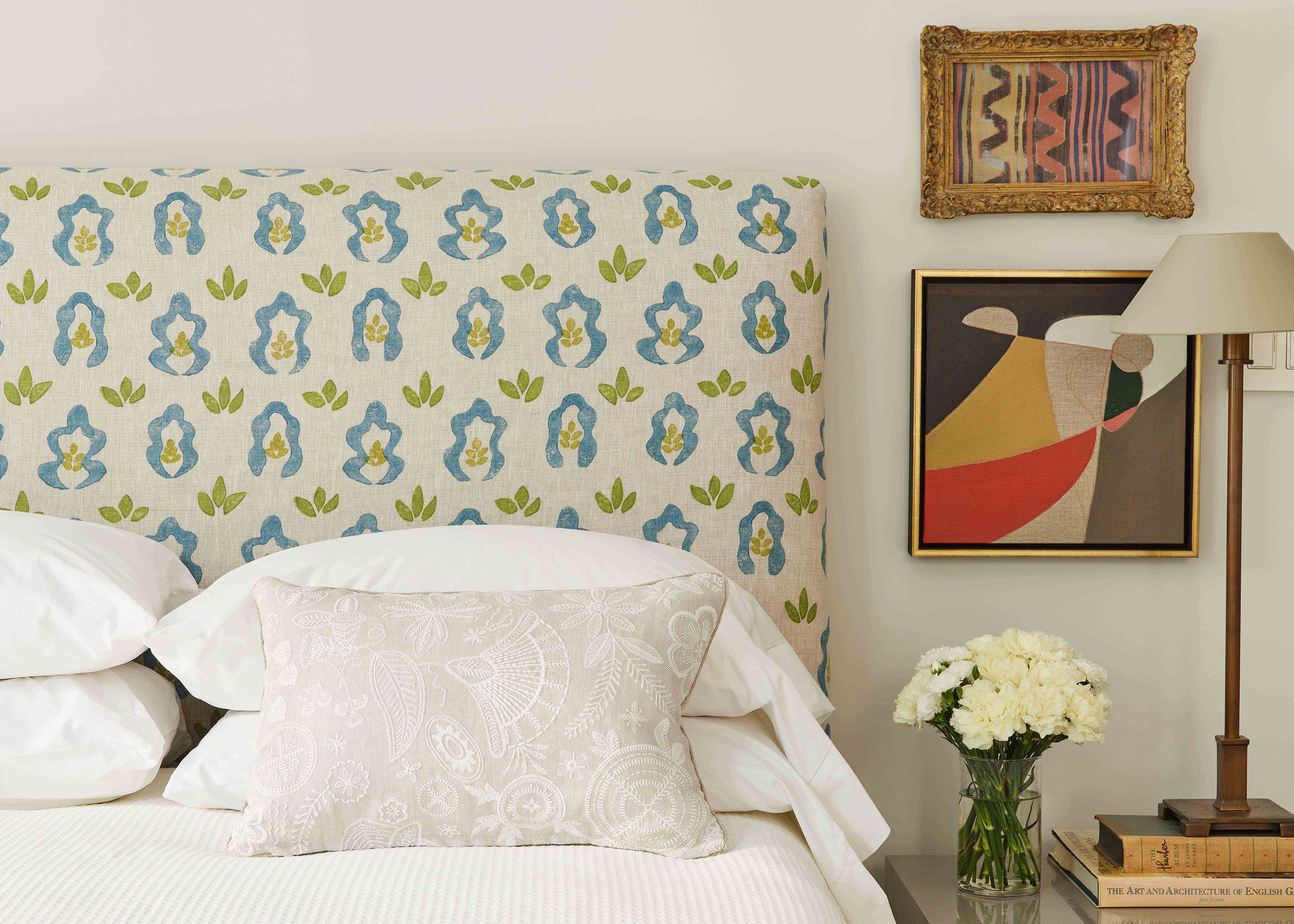 Image may contain: Cushion, Home Decor, Pillow, Lamp, Art, Painting, Bed, Furniture, Book, and Publication