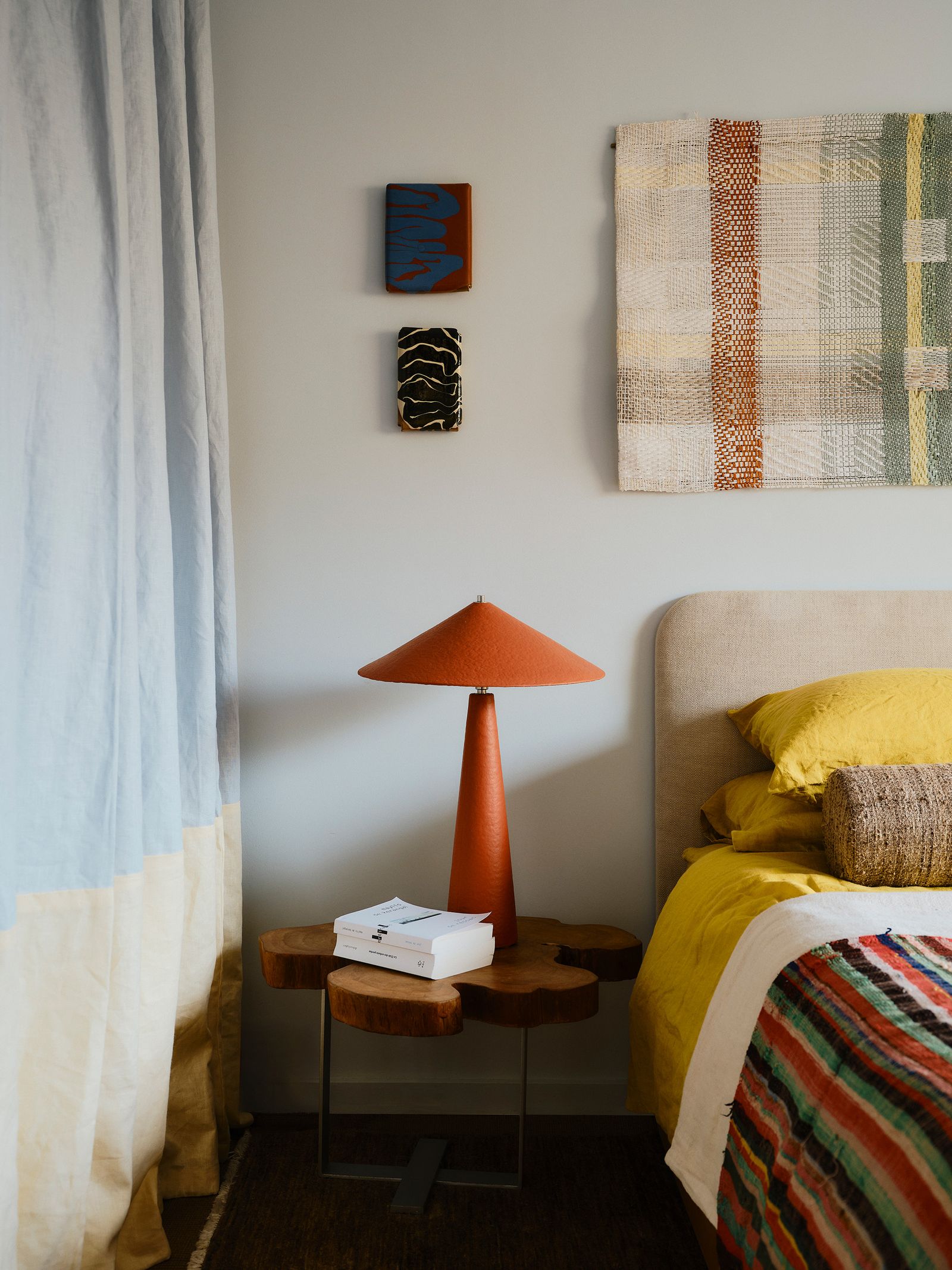 Image may contain Lamp Bed Furniture Cushion Home Decor Desk Table Bedroom Indoors Room Dorm Room and Box
