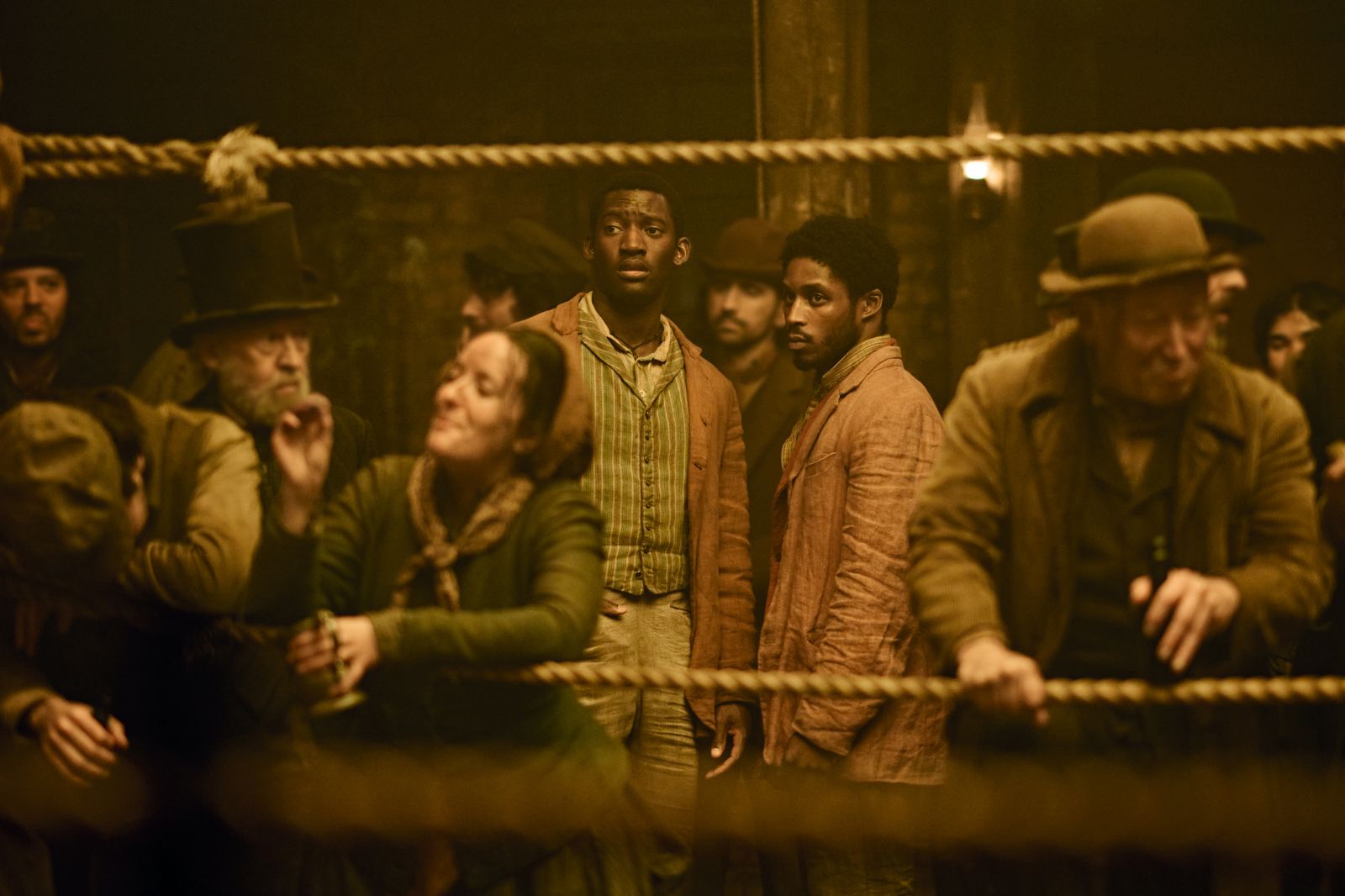 Image may contain Malachi Kirby Gotye Adult Person Clothing Hat Dungeon Coat and Cup