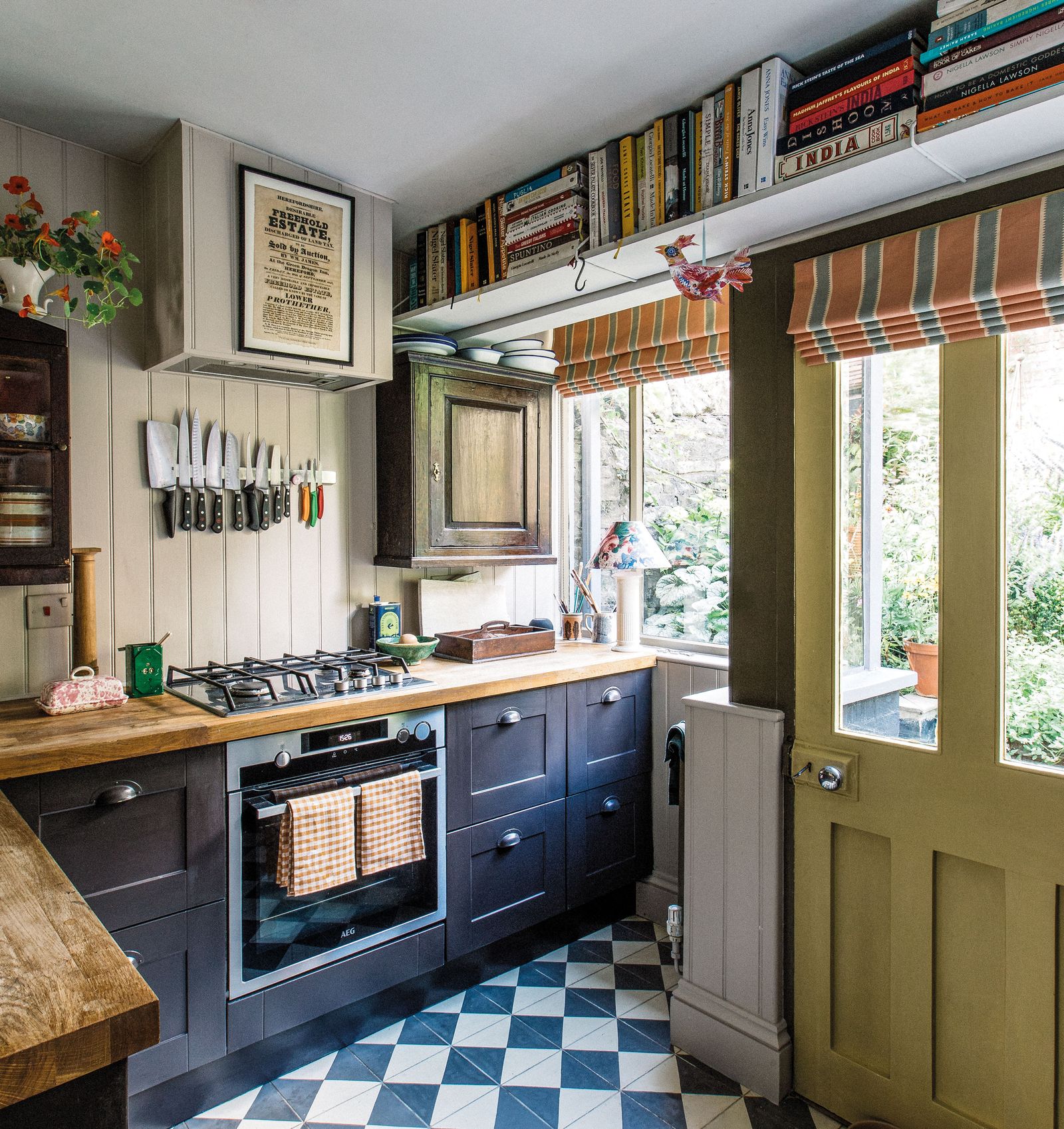 Image may contain Indoors Kitchen Interior Design Cooktop Lamp Home Decor and Plant