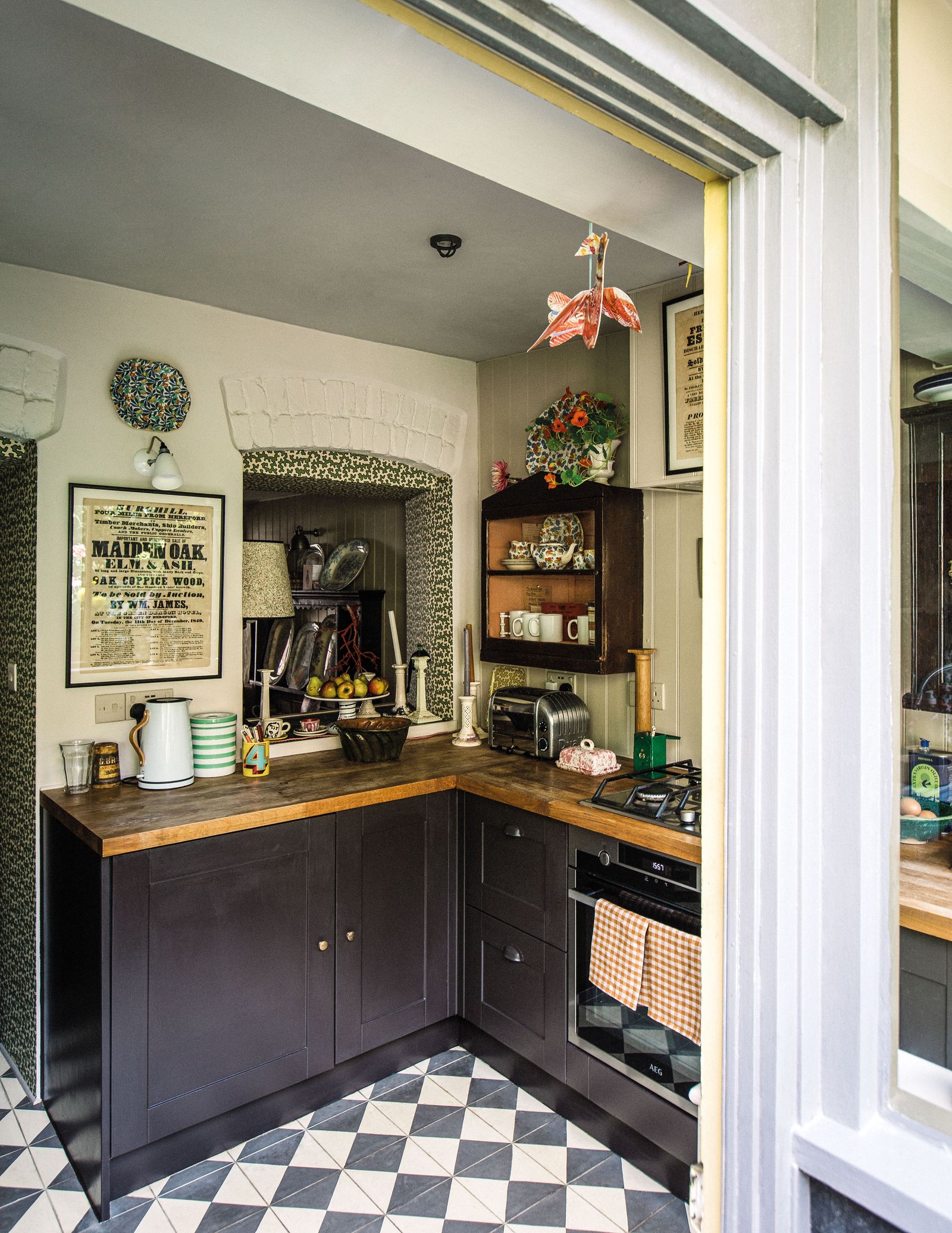 Image may contain Indoors Interior Design Kitchen Lamp Cup Art Painting Home Decor Sink Sink Faucet and Candle