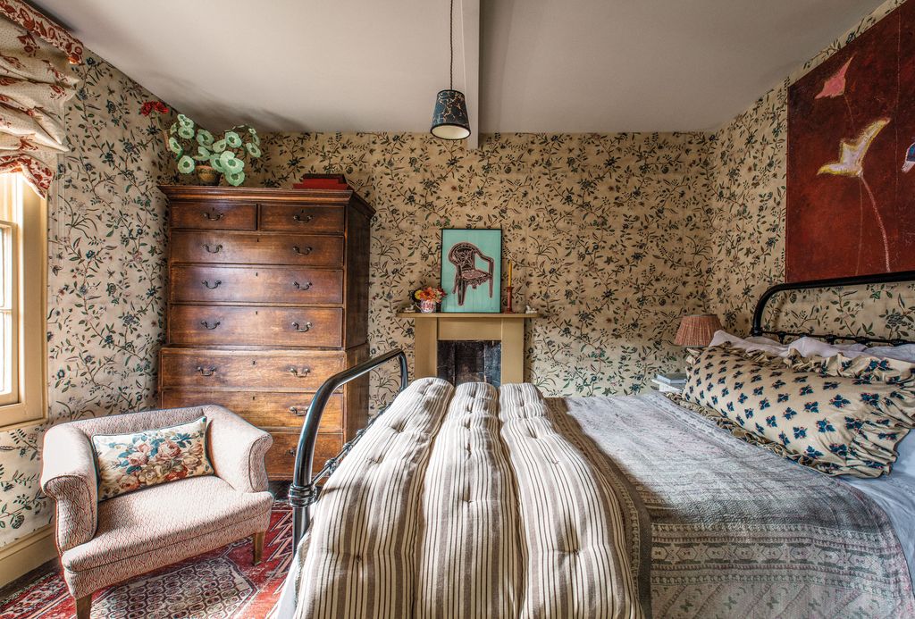 Image may contain Indoors Interior Design Home Decor Lamp Bed Furniture Bedroom Dorm Room Room Couch and Rug